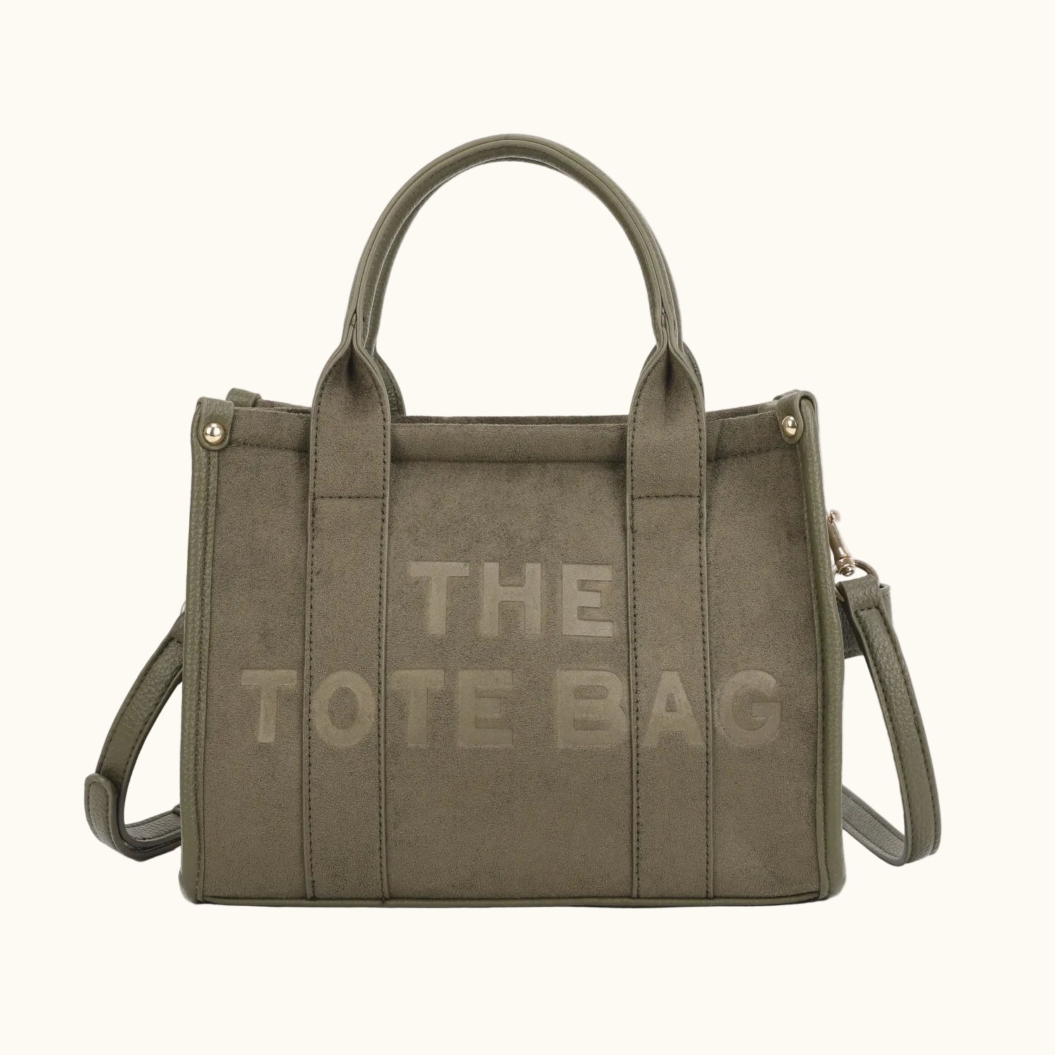 Green tote bag with 'THE TOTE BAG' text on a white background