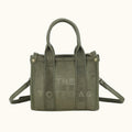 Green tote bag with 'THE TOTEBAG' text on a white background
