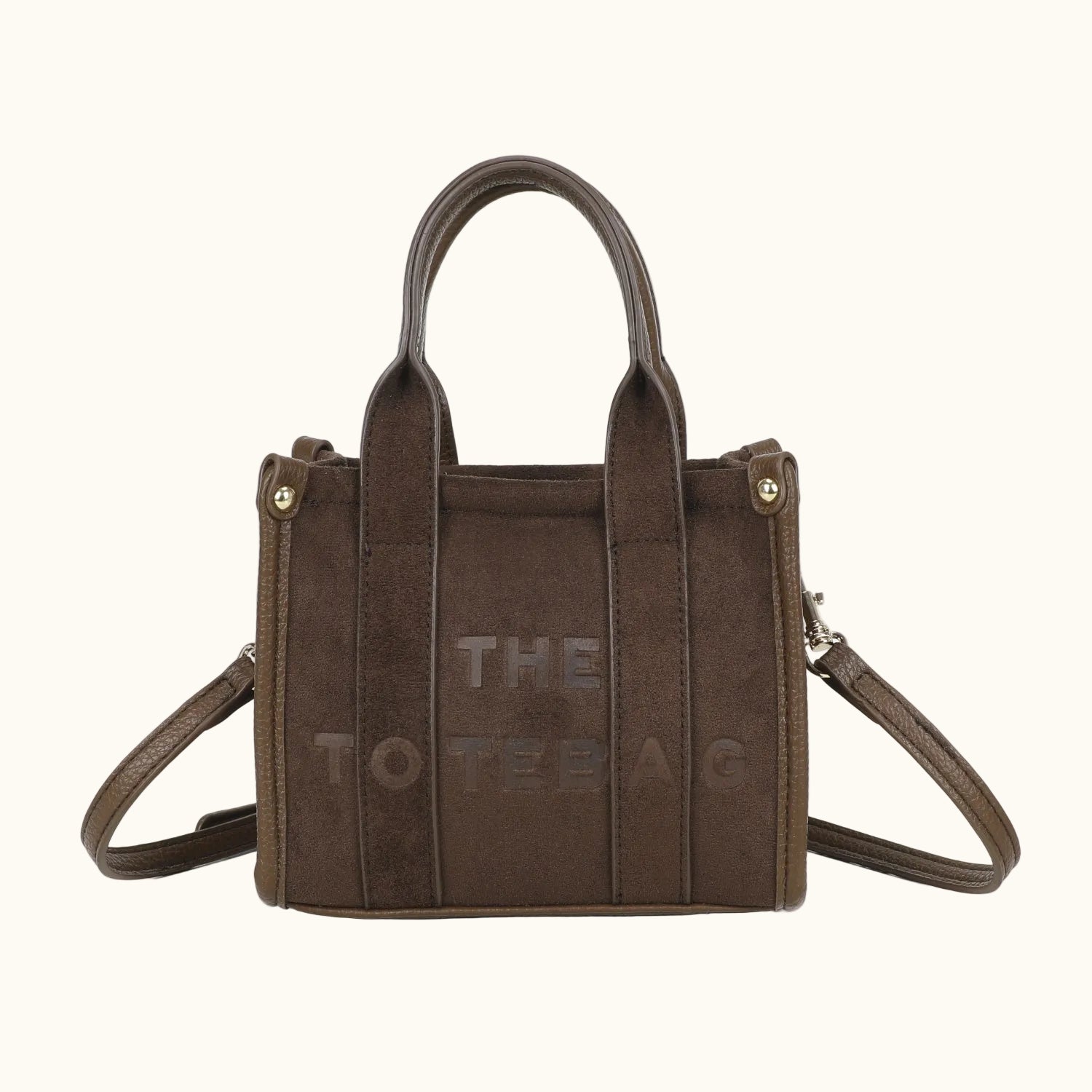 Brown handbag with 'THE TOTE BAG' text on a white background