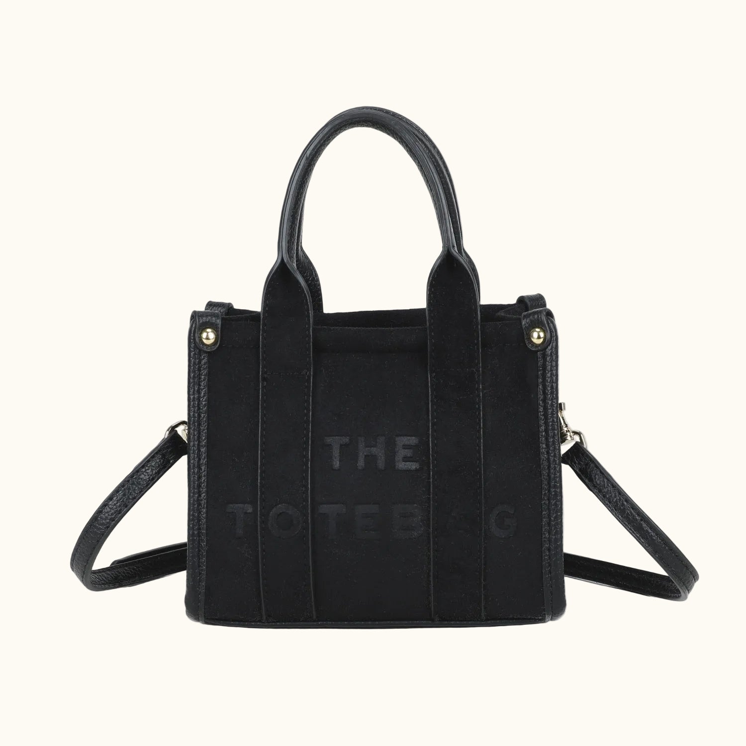 Black handbag with 'The Tote Bag' branding on a white background