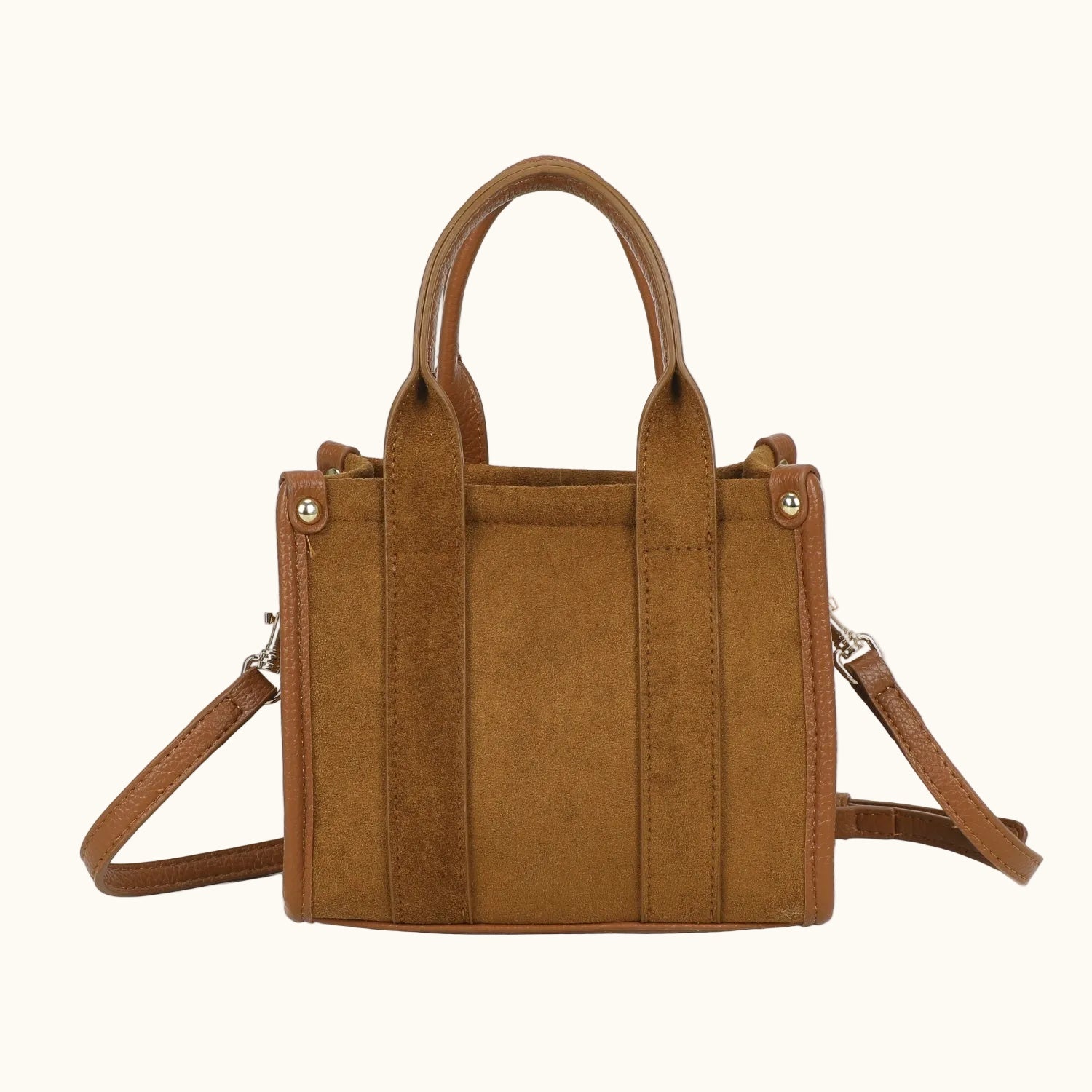 Brown handbag with a shoulder strap on a white background