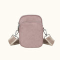 Pink crossbody bag with a strap on a white background