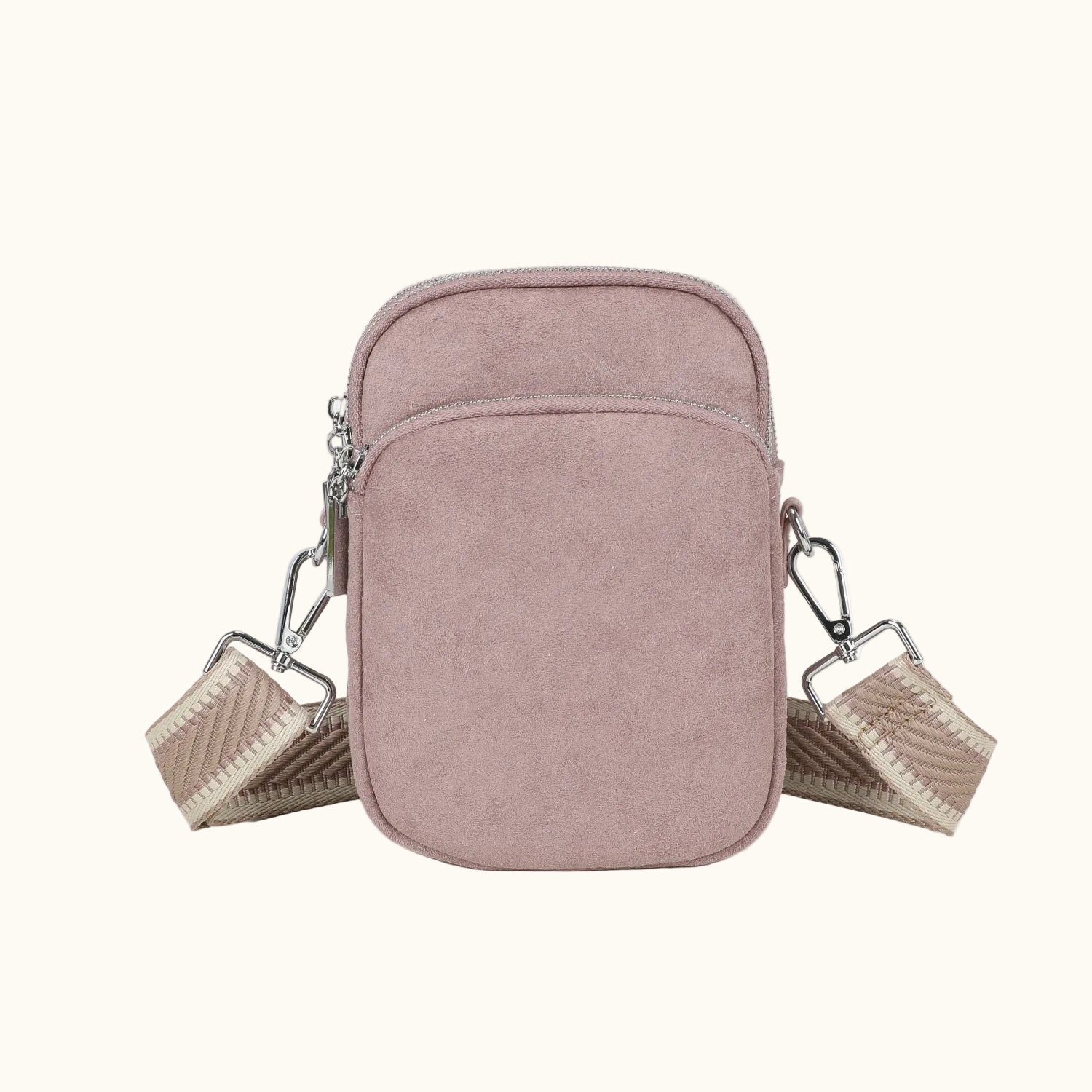 Pink crossbody bag with a strap on a white background