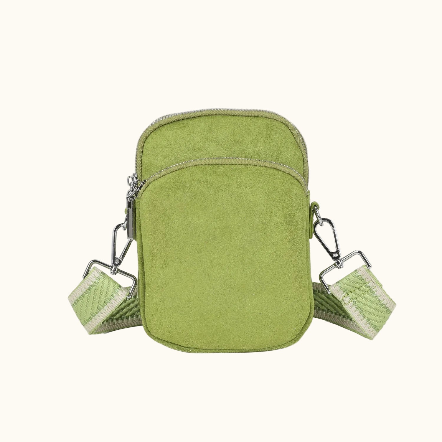 Green crossbody bag with multiple compartments on a white background