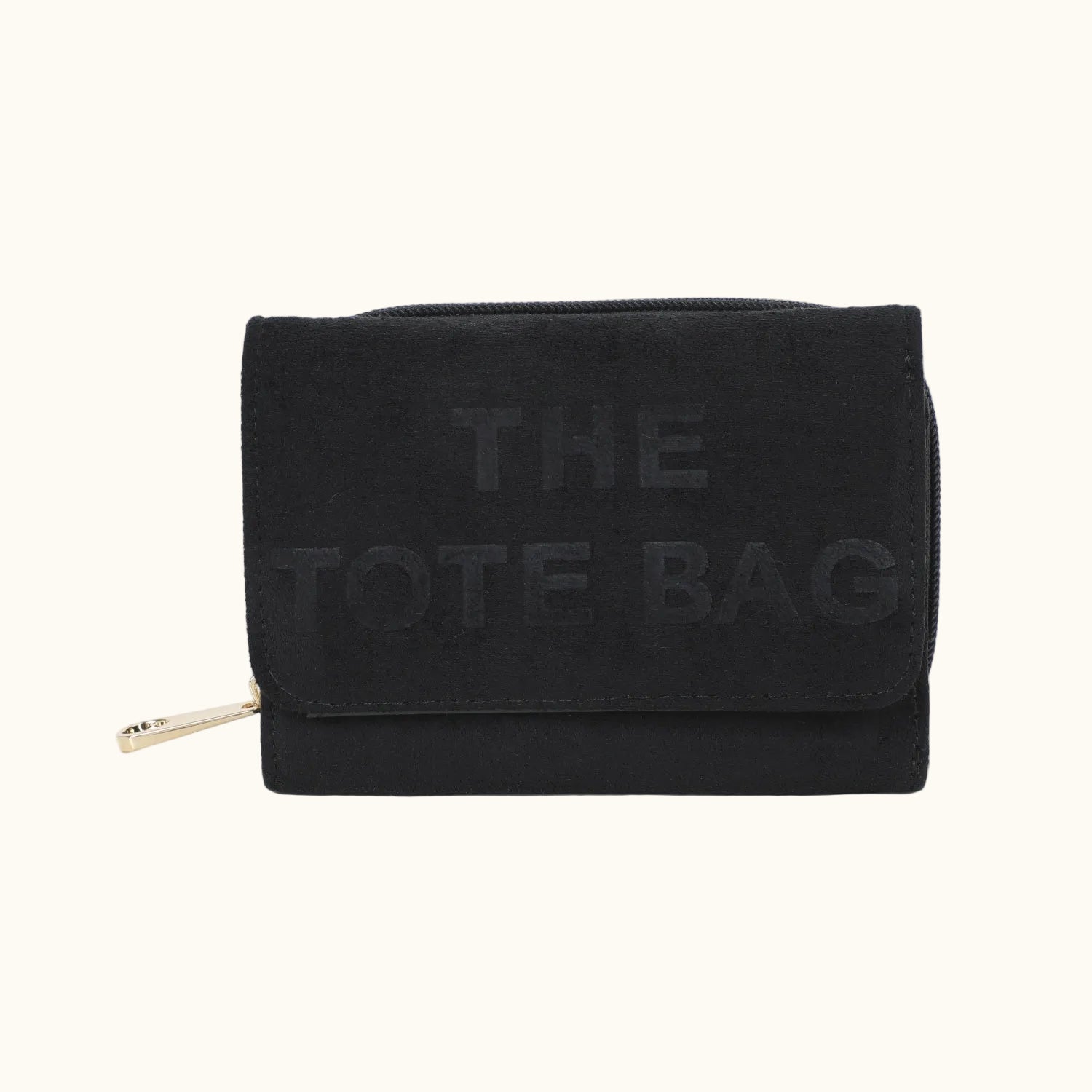 Black tote bag with 'THE TOTE BAG' text on a white background
