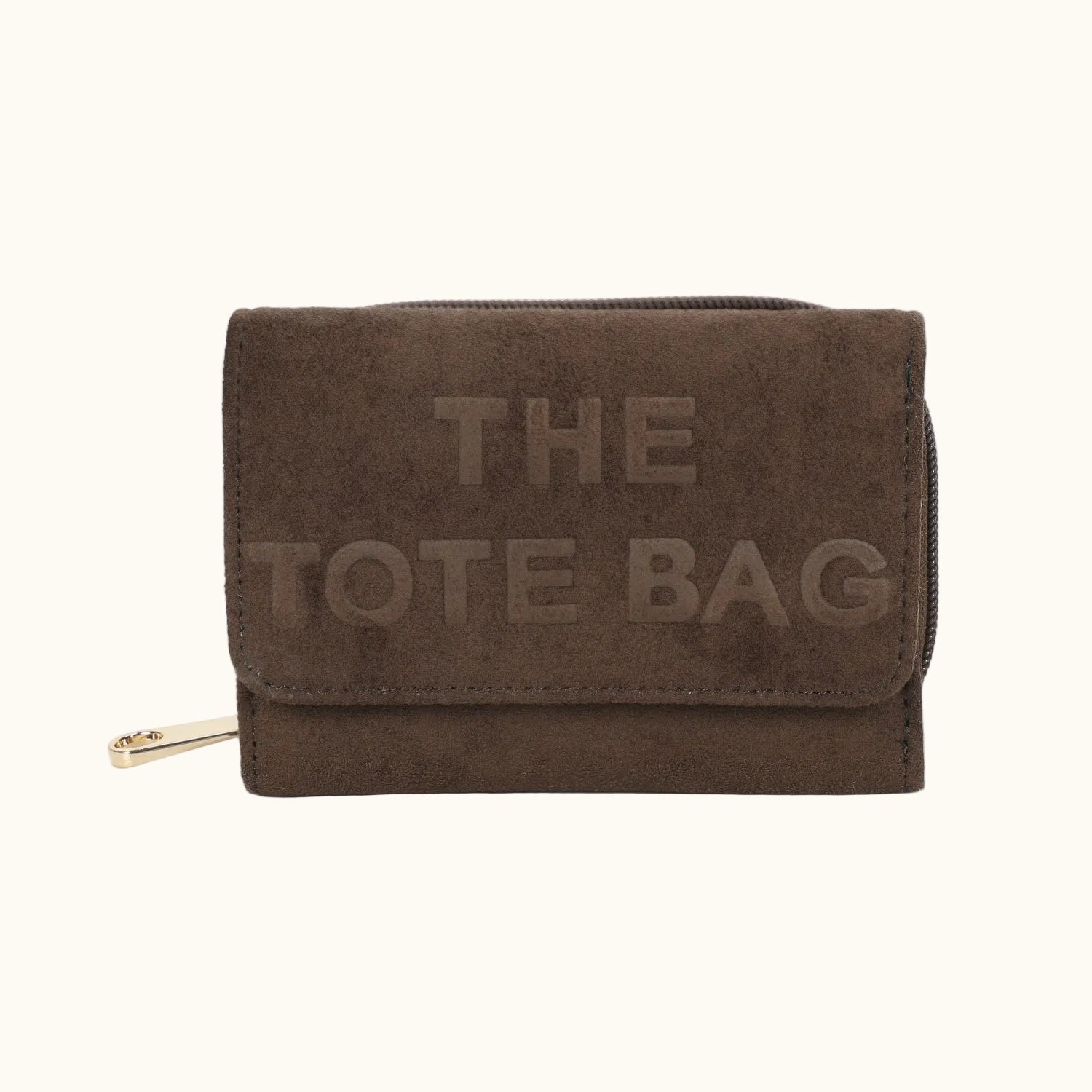 Brown suede tote bag with 'THE TOTE BAG' text on a white background