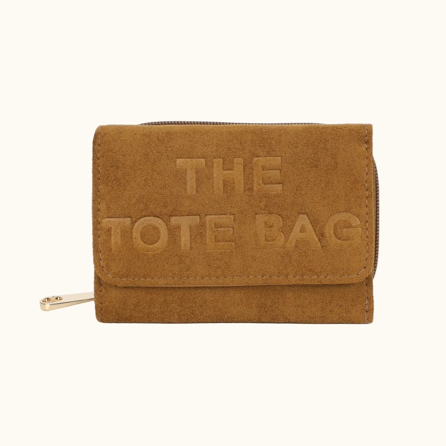 Brown suede tote bag with 'THE TOTE BAG' embossed on it against a white background