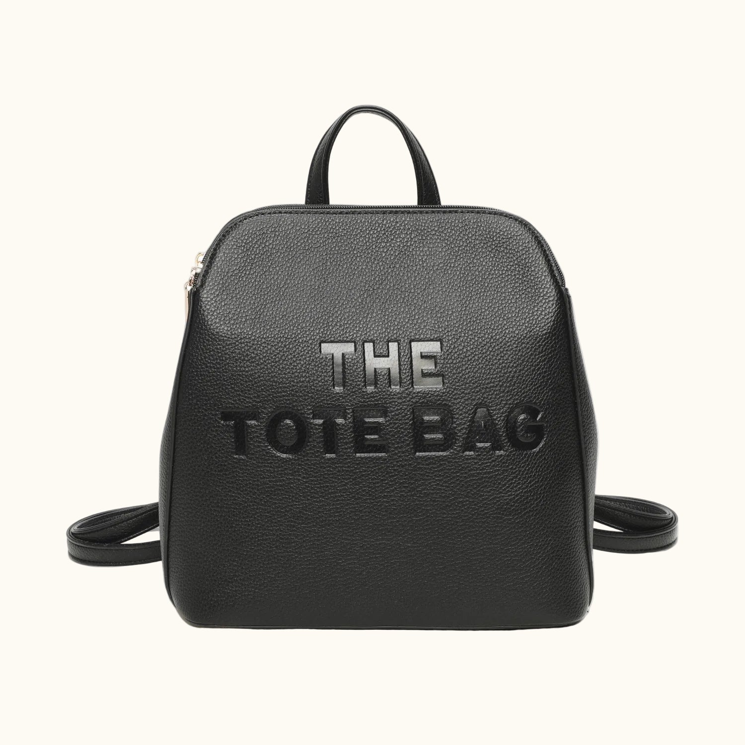 Black backpack with 'THE TOTE BAG' text on a white background
