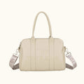 Beige handbag with a strap on a white background
