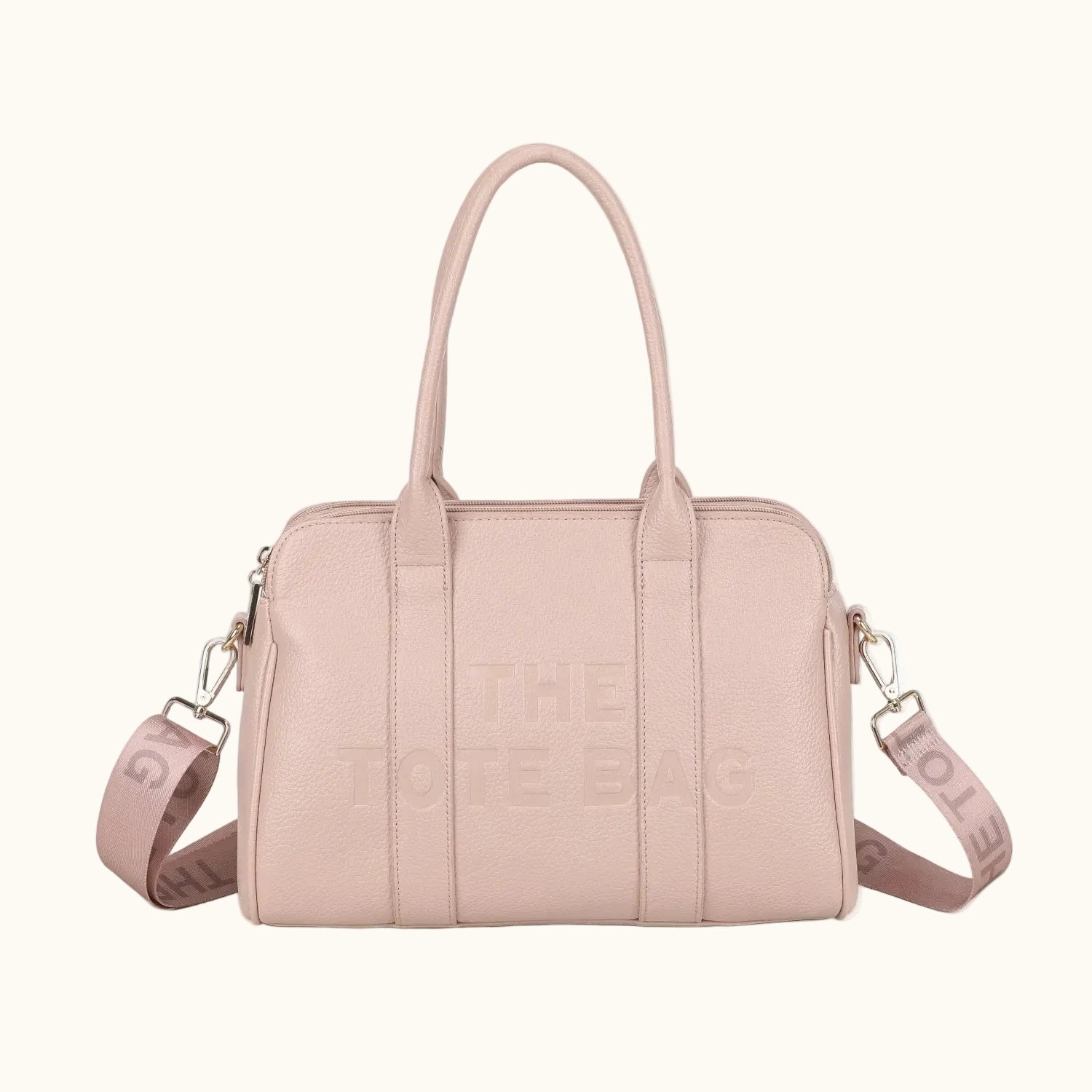 Pink handbag with visible branding on a white background