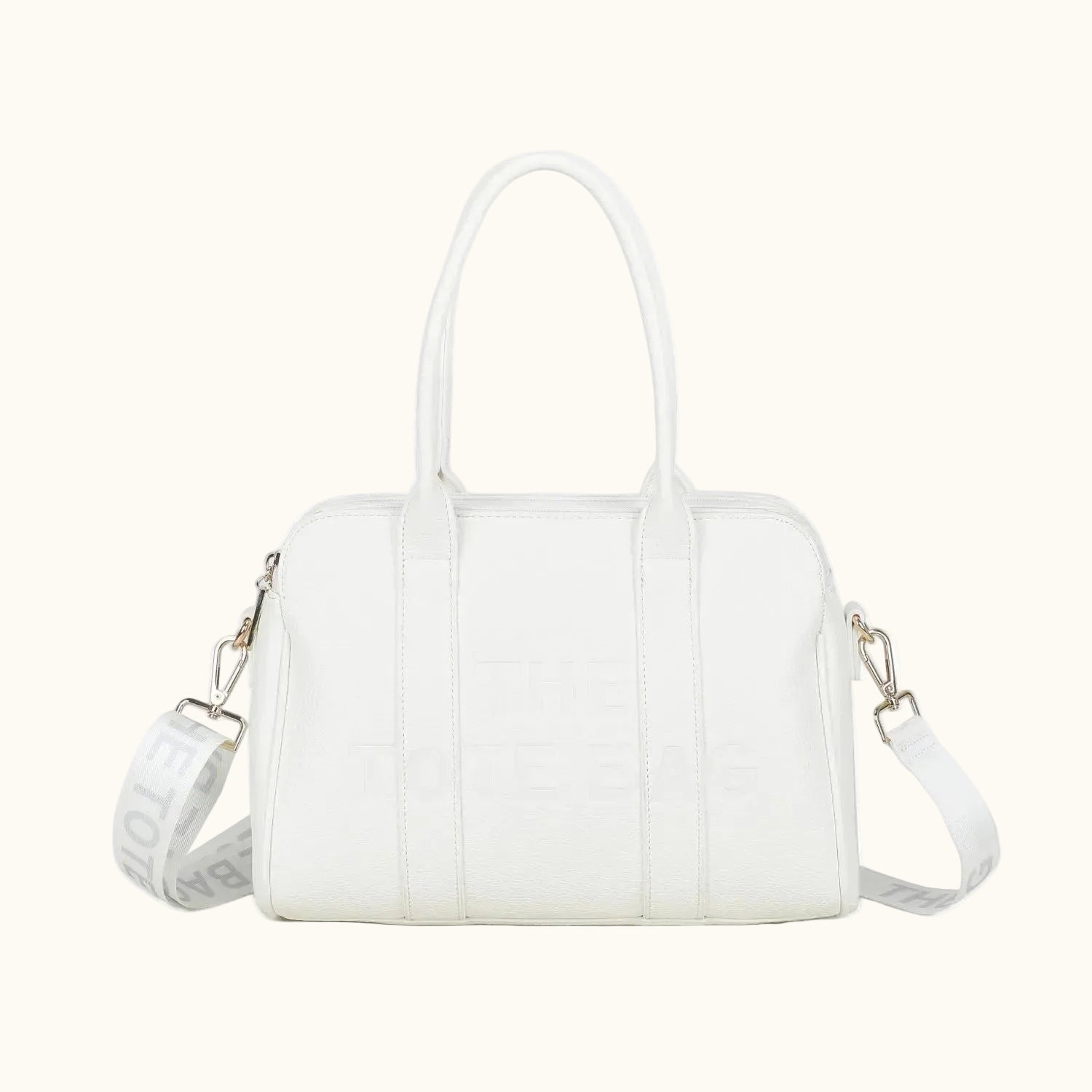 White handbag with a strap on a white background