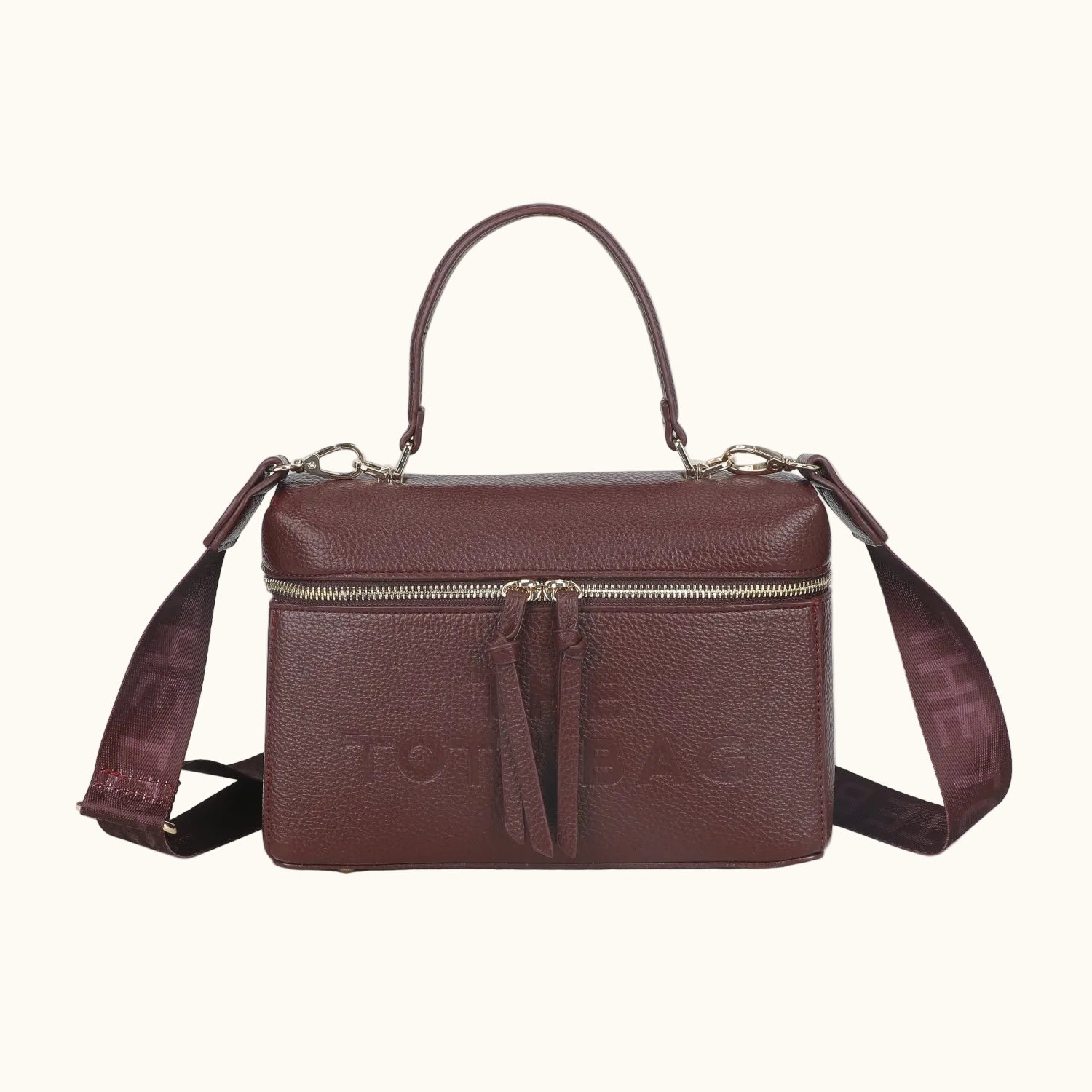 Brown leather handbag with a strap on a white background