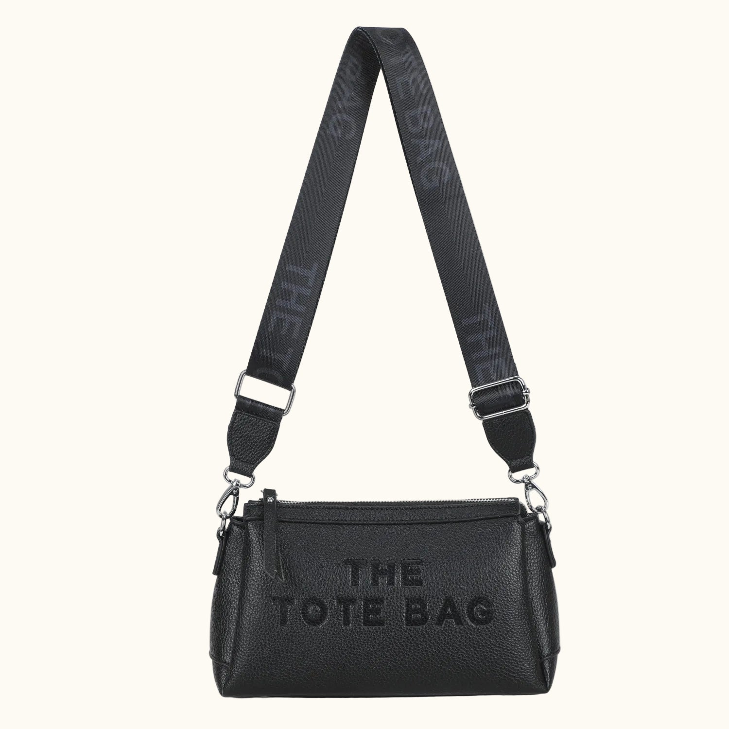 Black tote bag with 'THE TOTE BAG' text on a white background