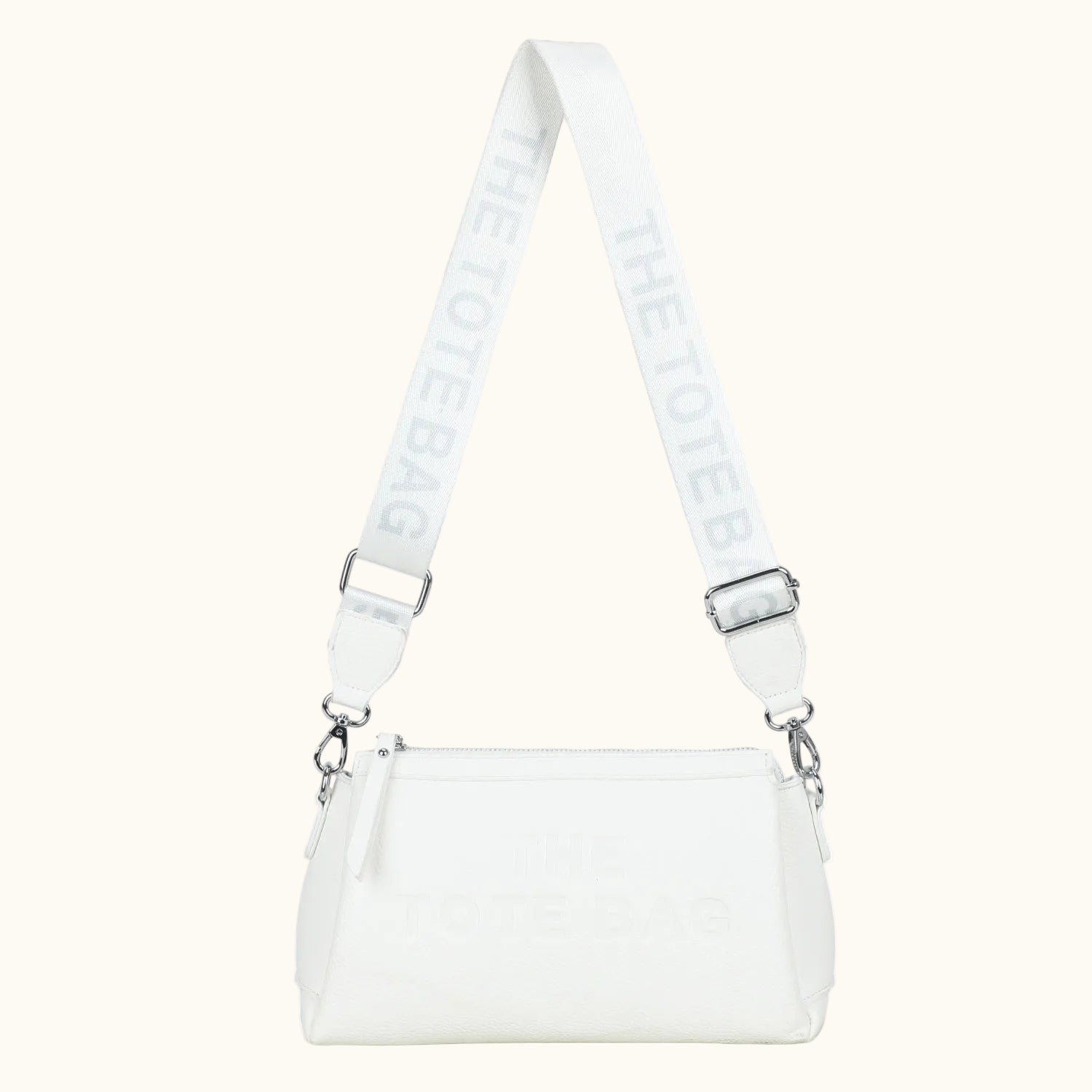 White handbag with a matching strap on a white background