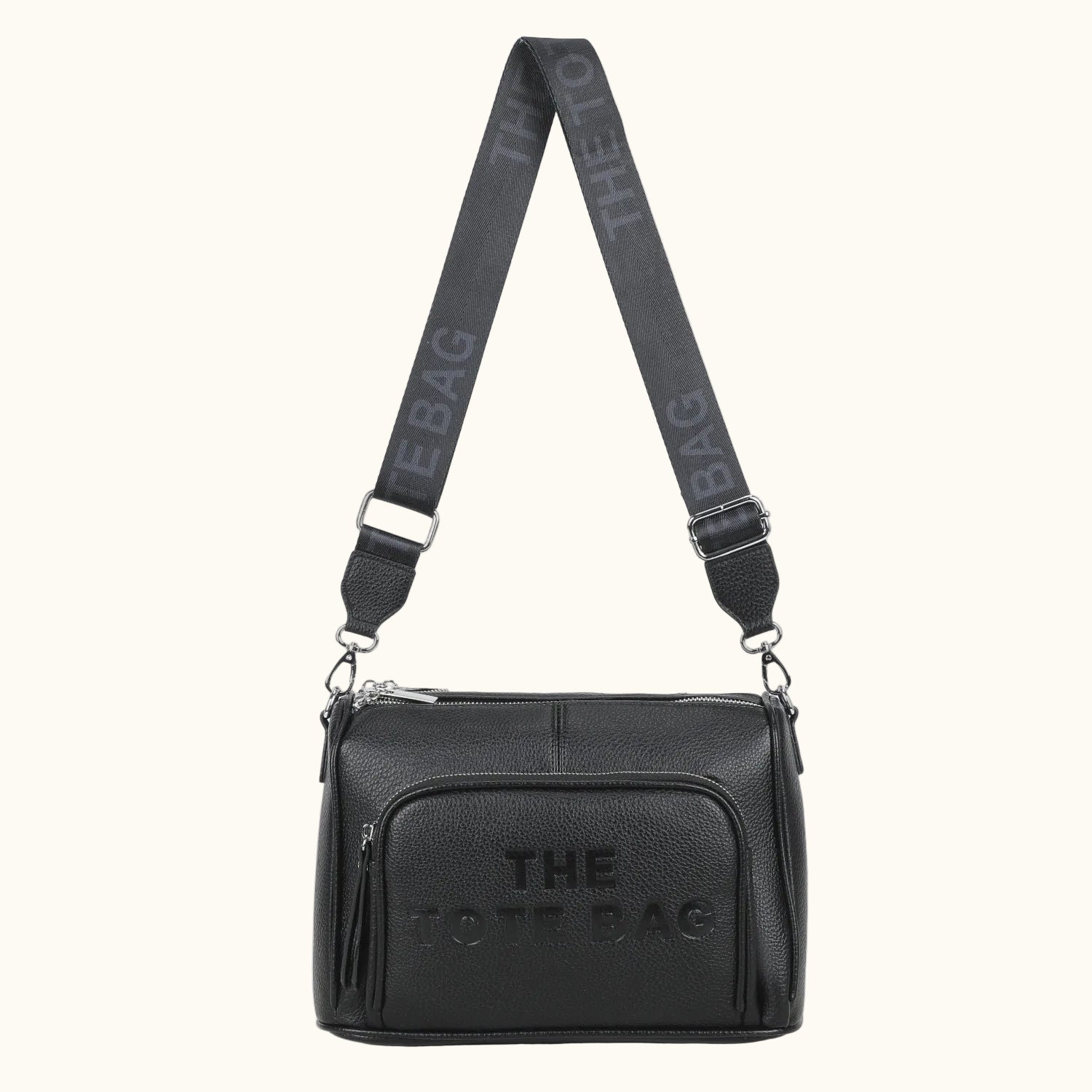 Black shoulder bag with 'THE TOTE BAG' branding on a white background