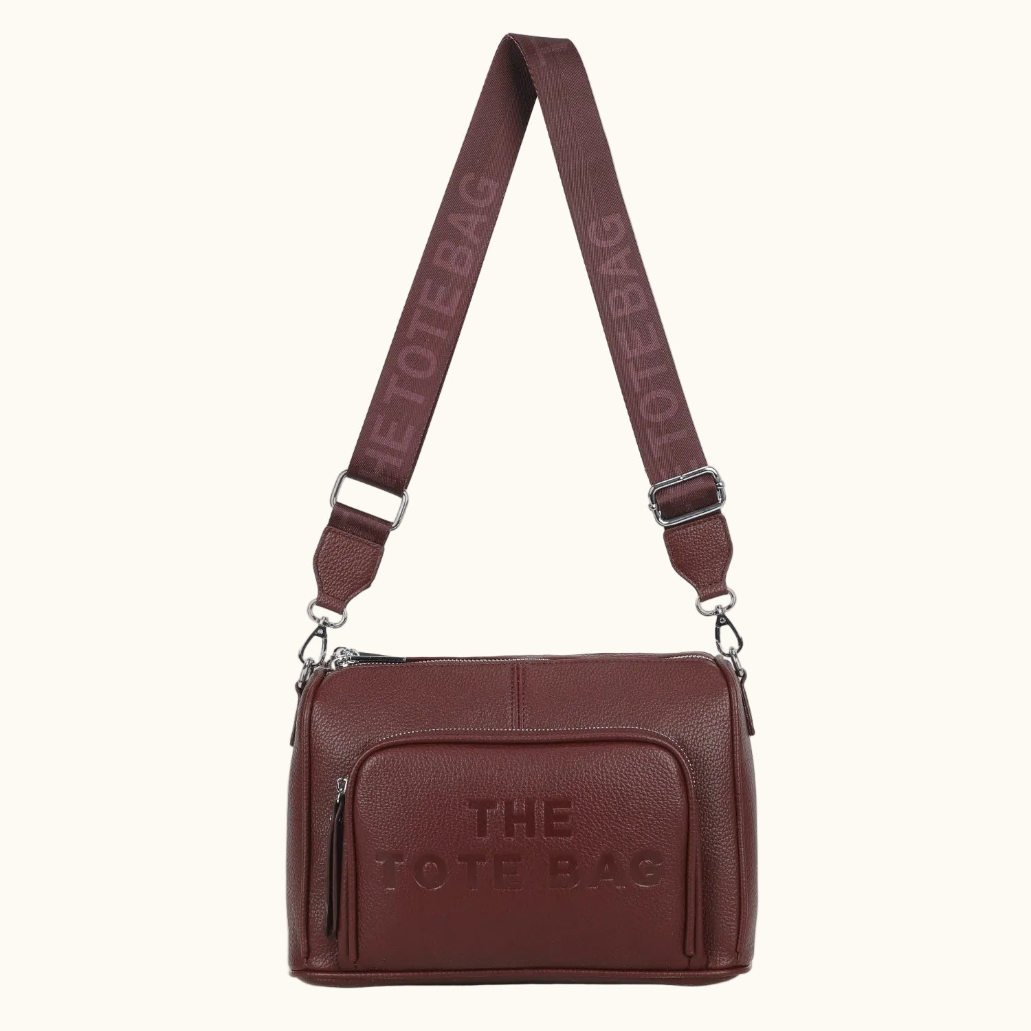 Brown leather tote bag with 'The Tote Bag' branding on a white background