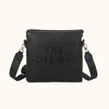 Black tote bag with 'THE TOTE BAG' embossed text on a white background