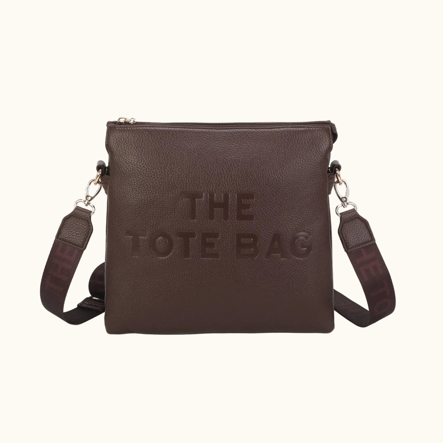 Brown tote bag with 'THE TOTE BAG' text on a white background