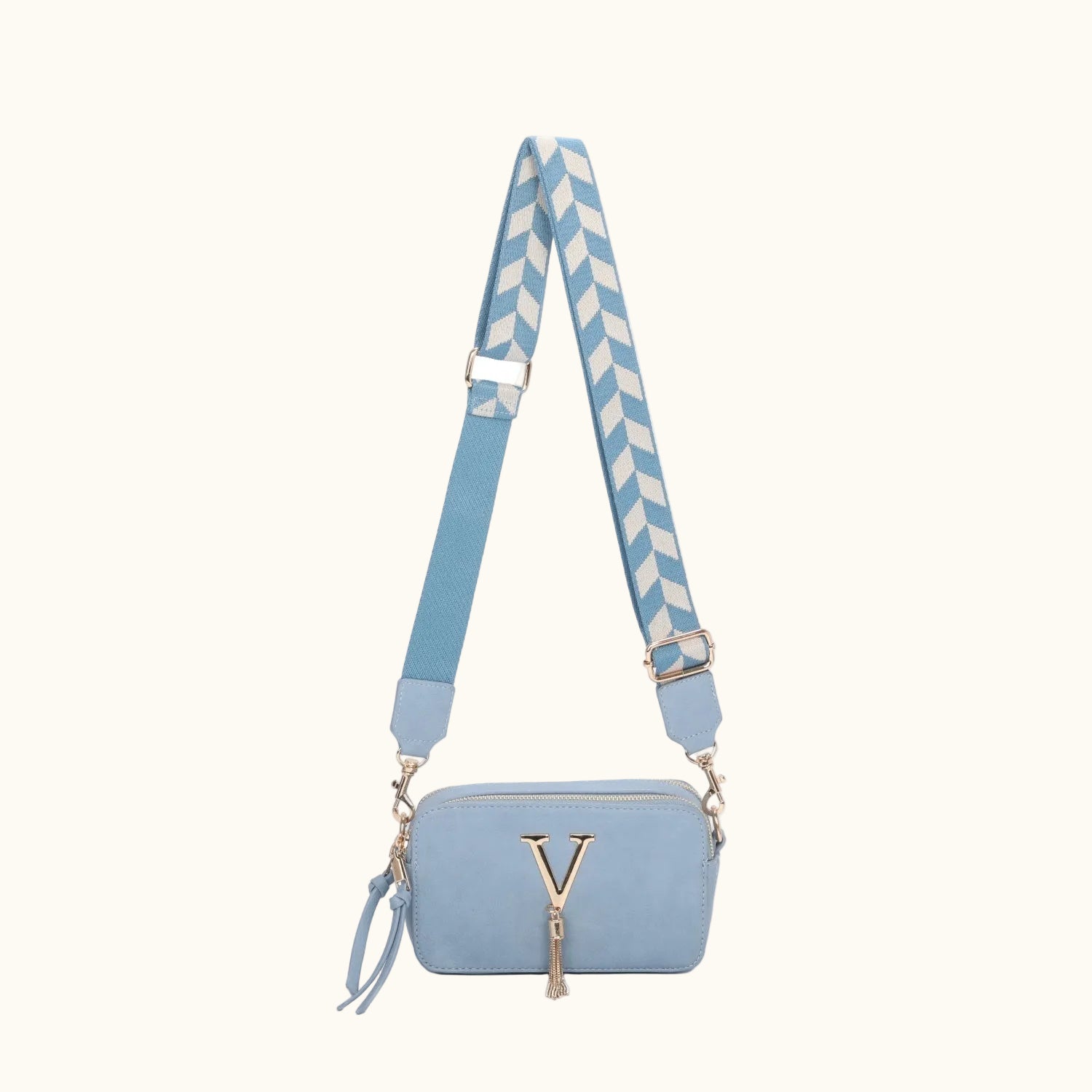 Light blue handbag with a matching strap on a white background