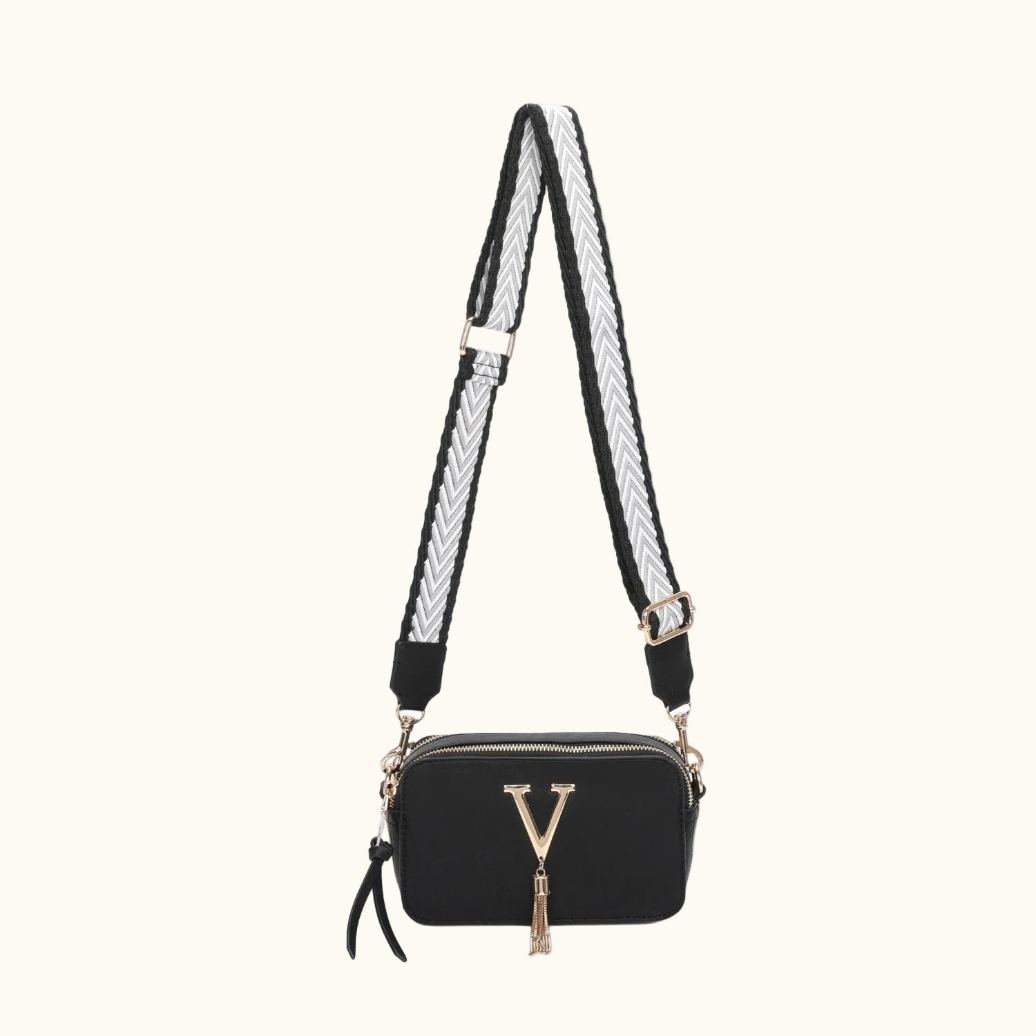 Black handbag with a braided strap on a white background
