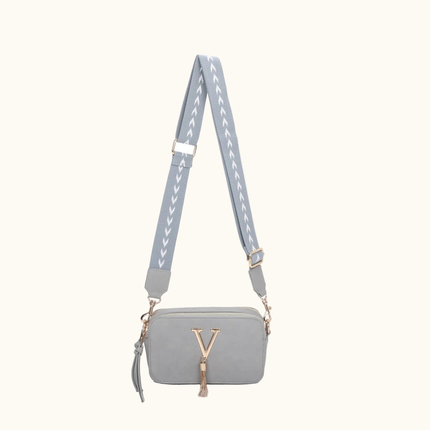 Gray handbag with a matching strap on a white background