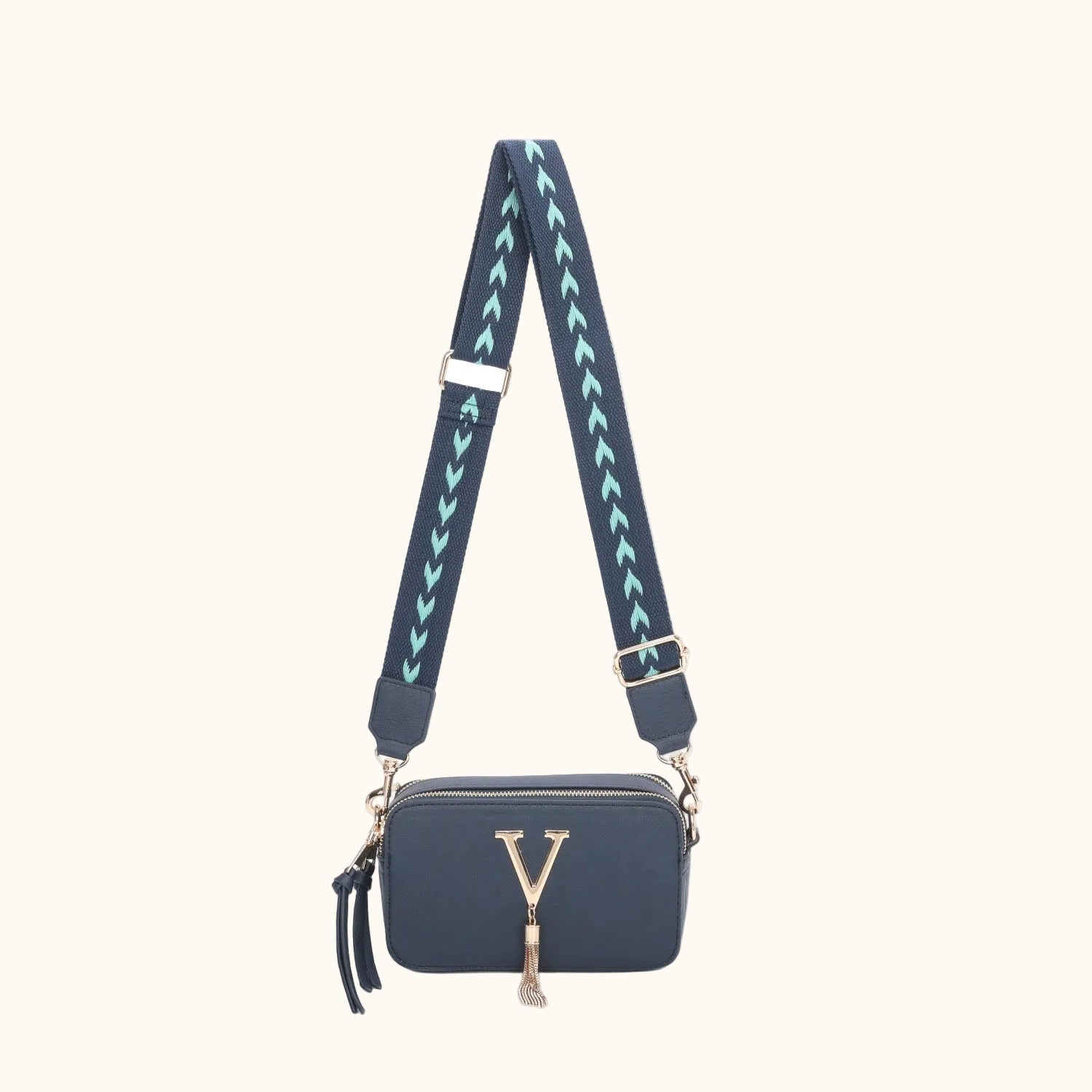 Navy blue handbag with a decorative strap on a white background
