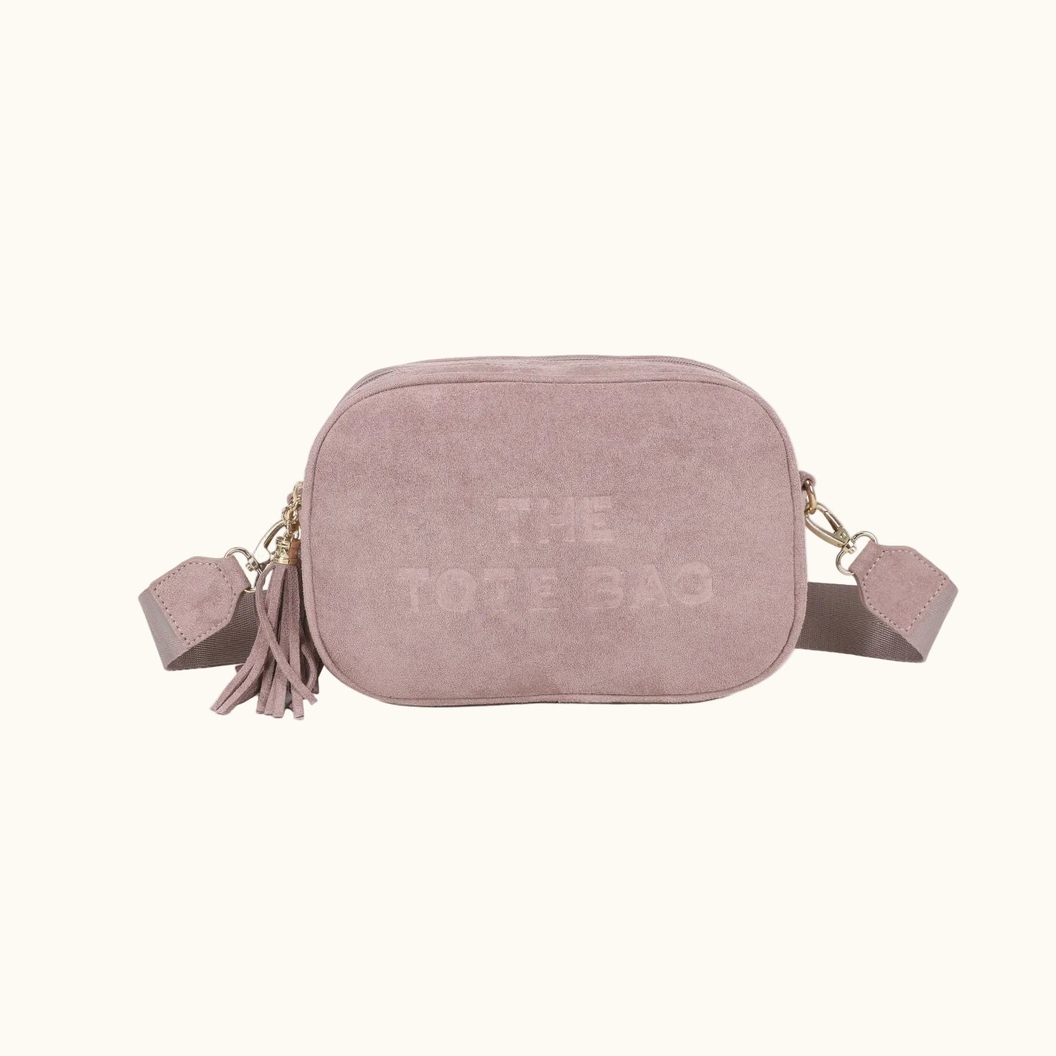 Pink suede crossbody bag with 'The Dofe Bag' branding on a white background