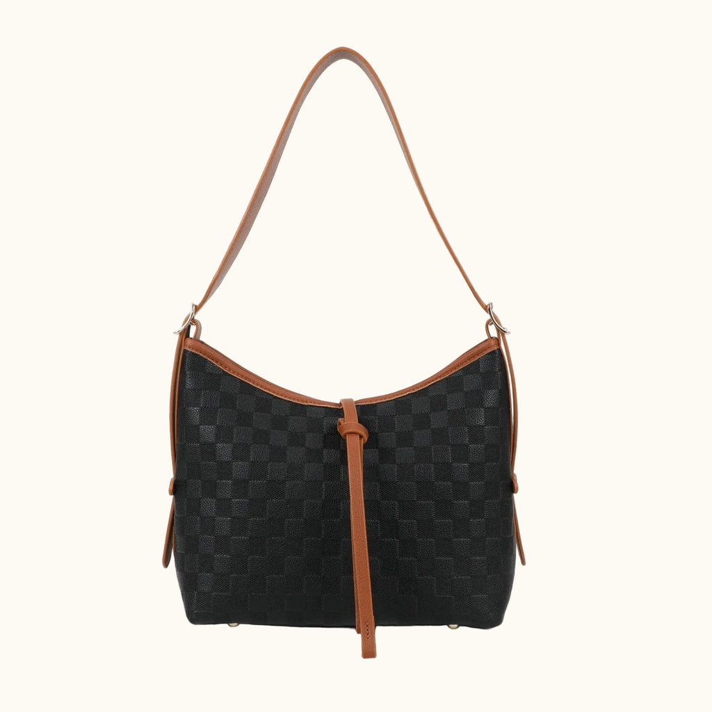 Black checkered handbag with brown straps on a white background