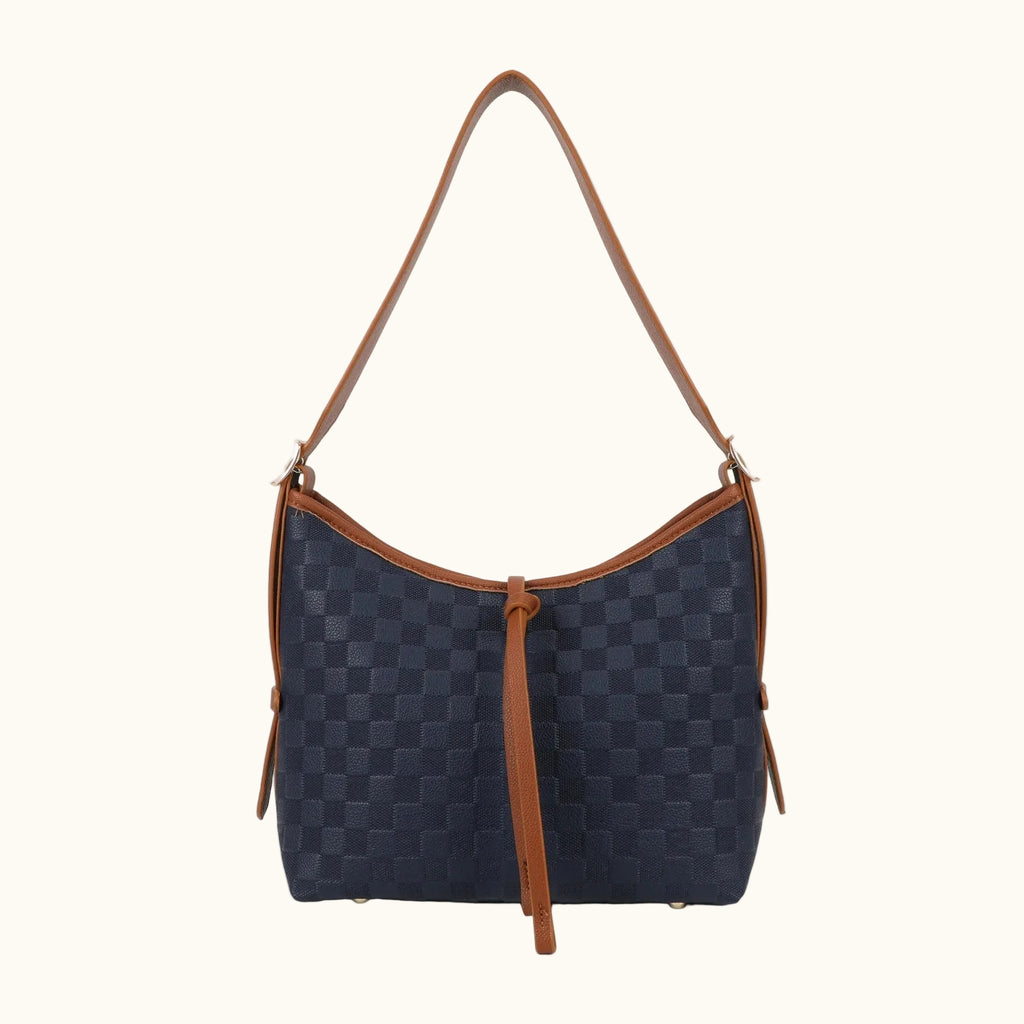 Navy blue handbag with brown leather accents on a white background