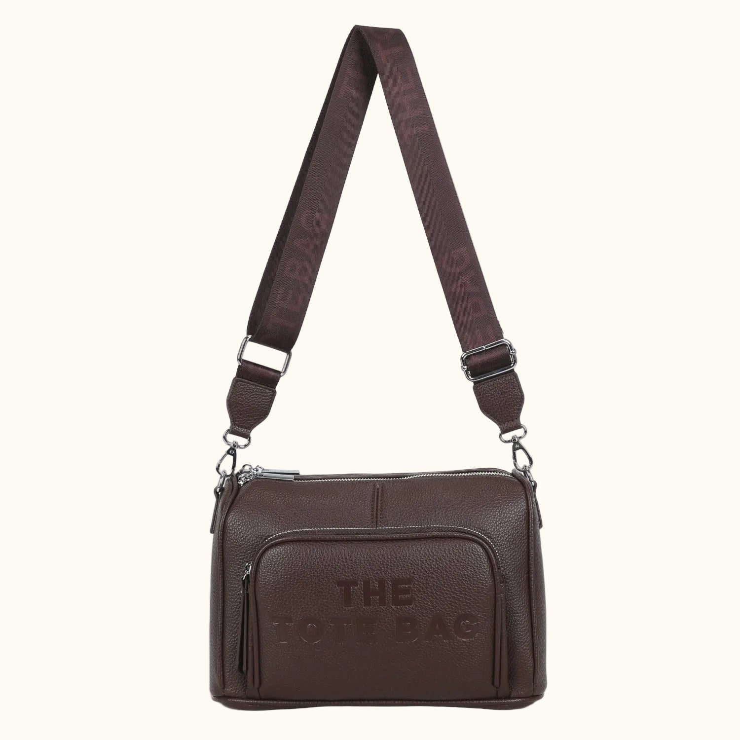 Brown leather bag with 'THE POLO BAG' branding on a white background