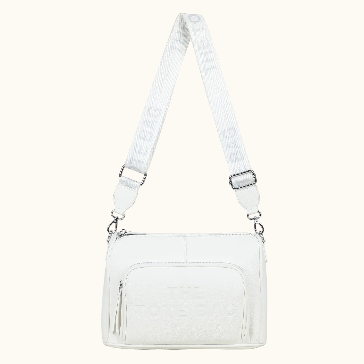 White crossbody bag with a visible brand logo on the strap against a white background