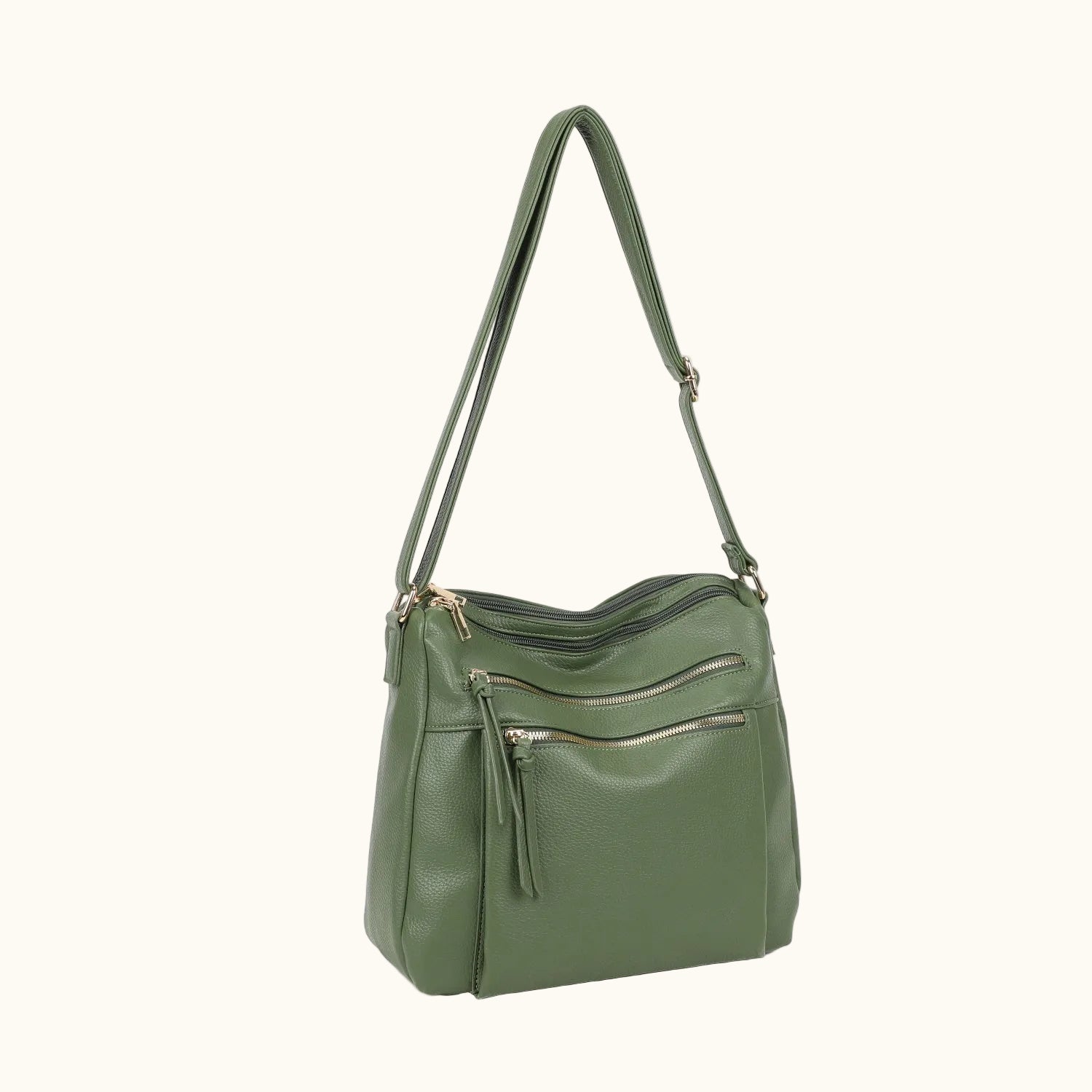 Green handbag with a shoulder strap on a white background