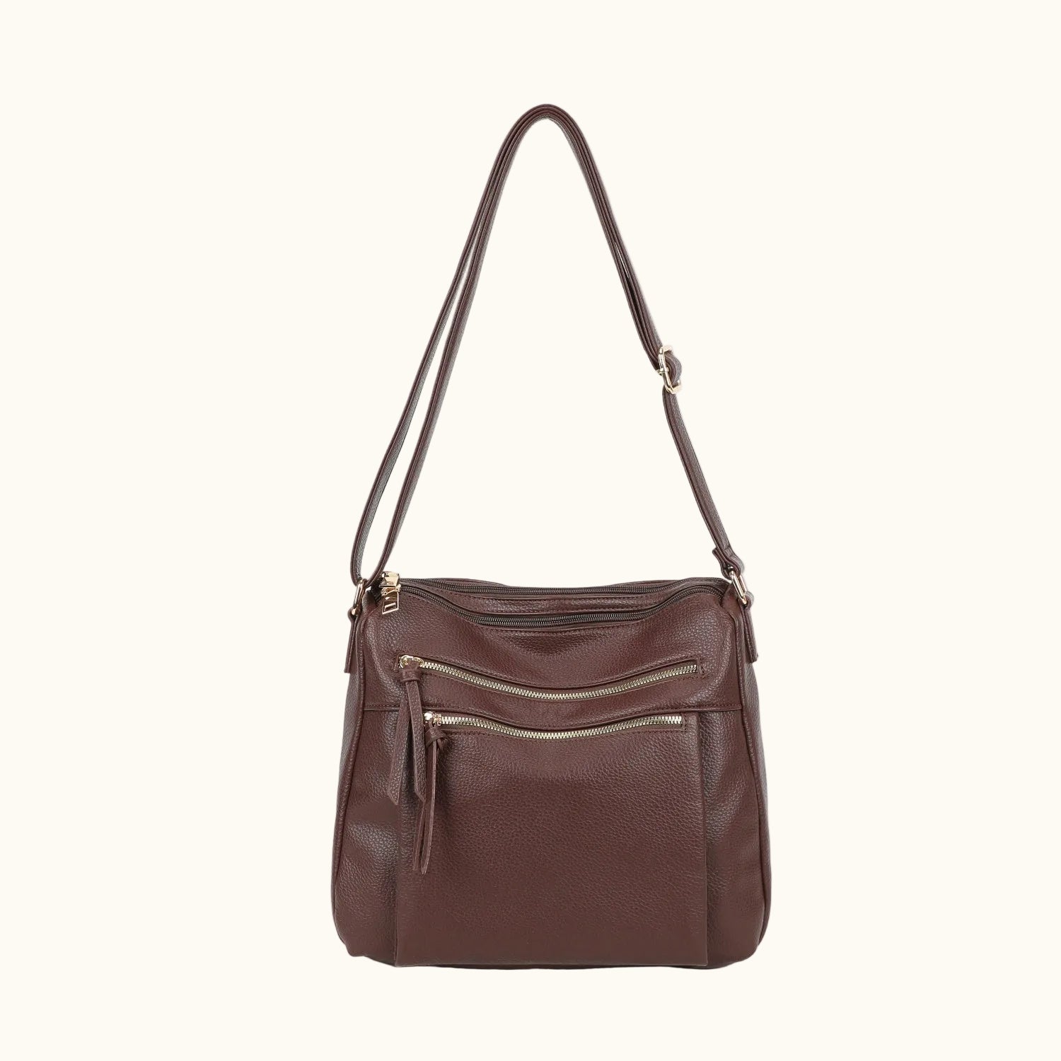 Brown leather handbag with a shoulder strap on a white background