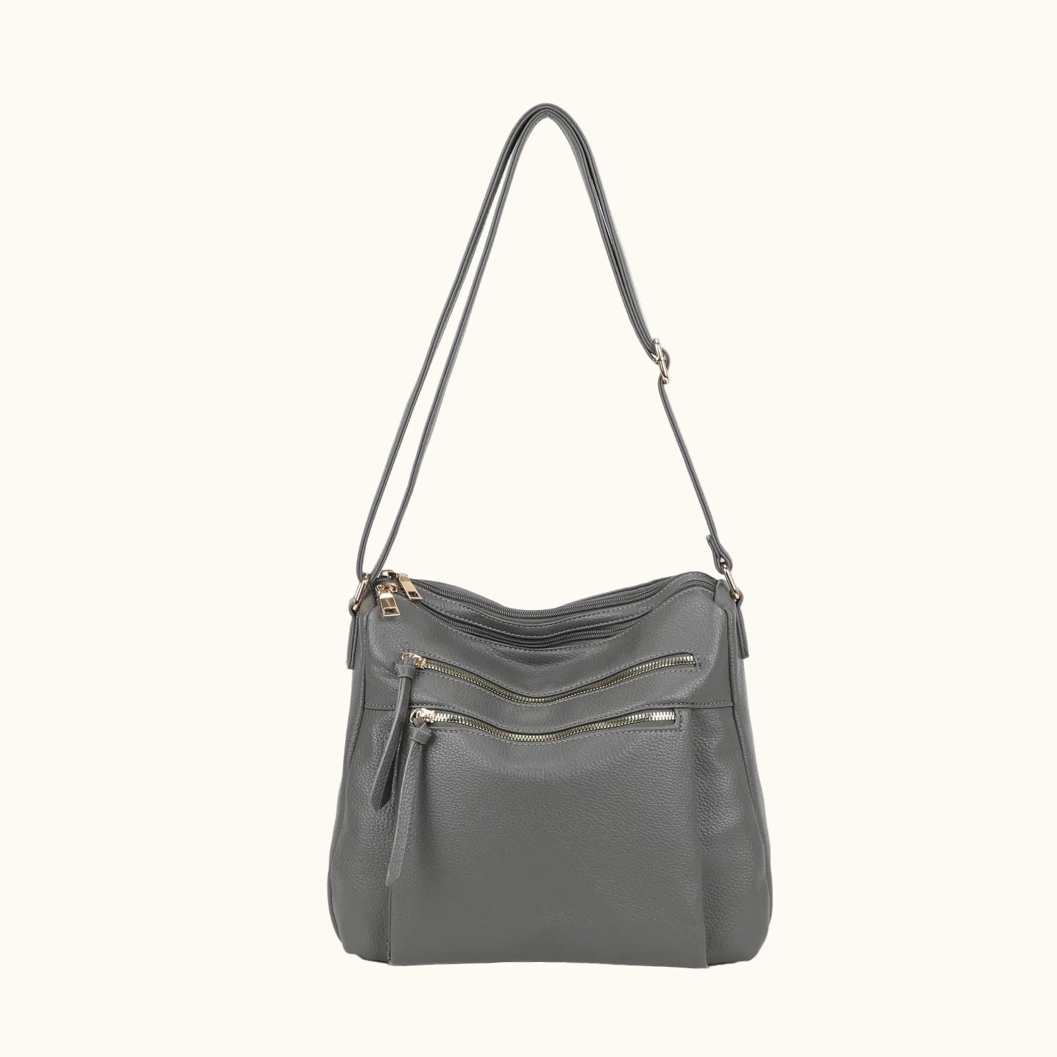Gray shoulder bag with gold zippers on a white background