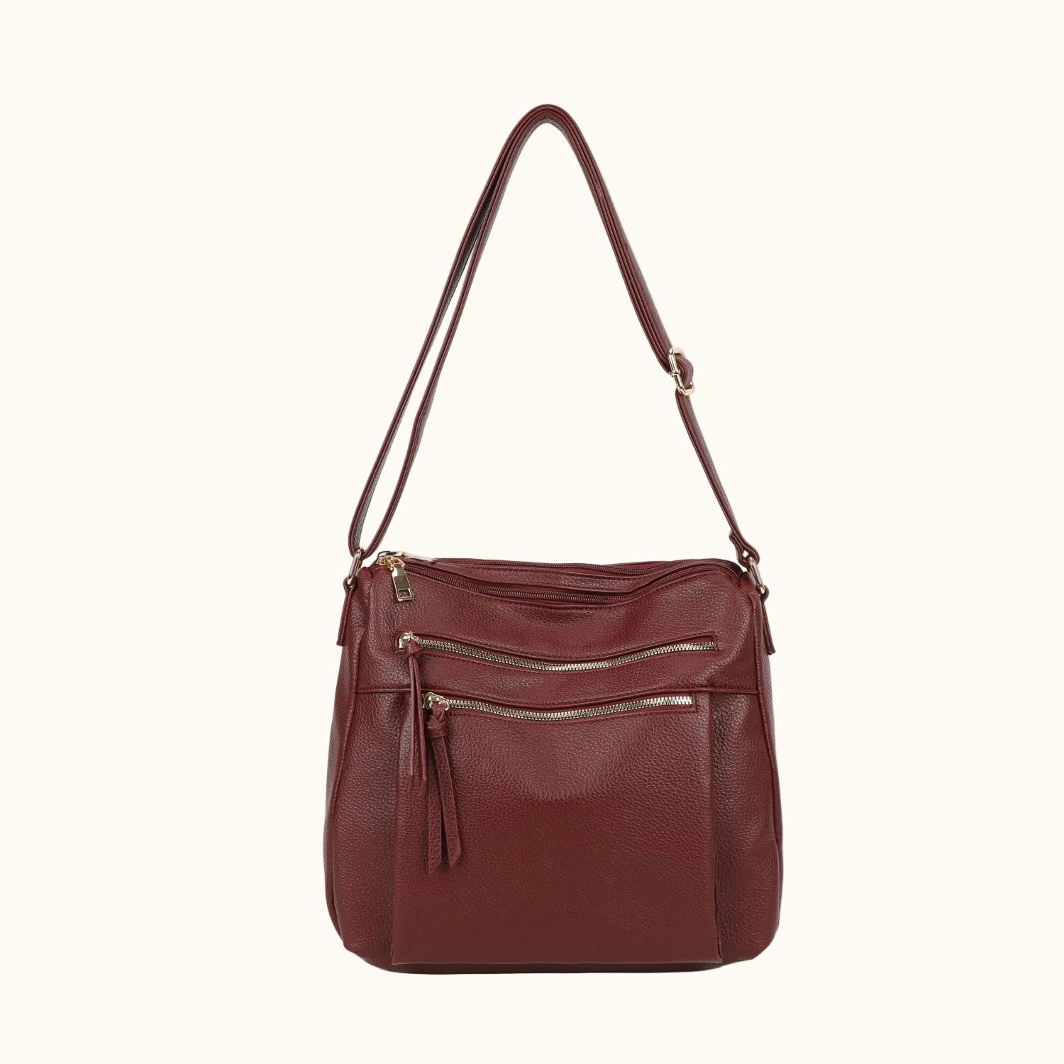 Brown leather handbag with a shoulder strap on a white background