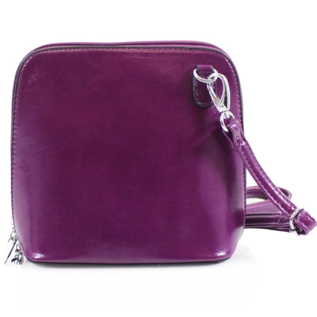 Purple handbag with a strap on a white background