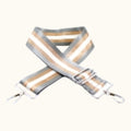 Striped strap with metal clasps on a white background