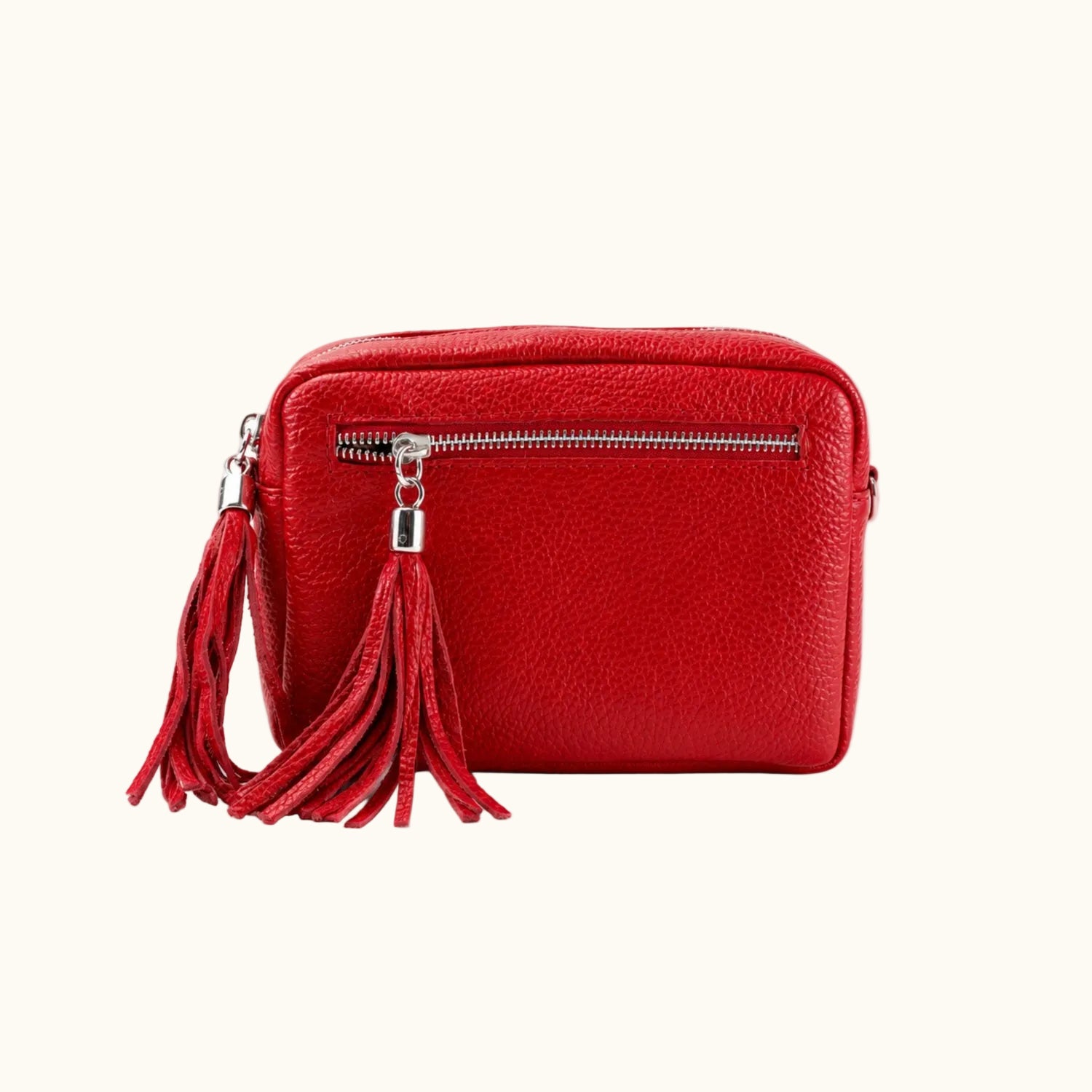 Red handbag with a tassel on a white background