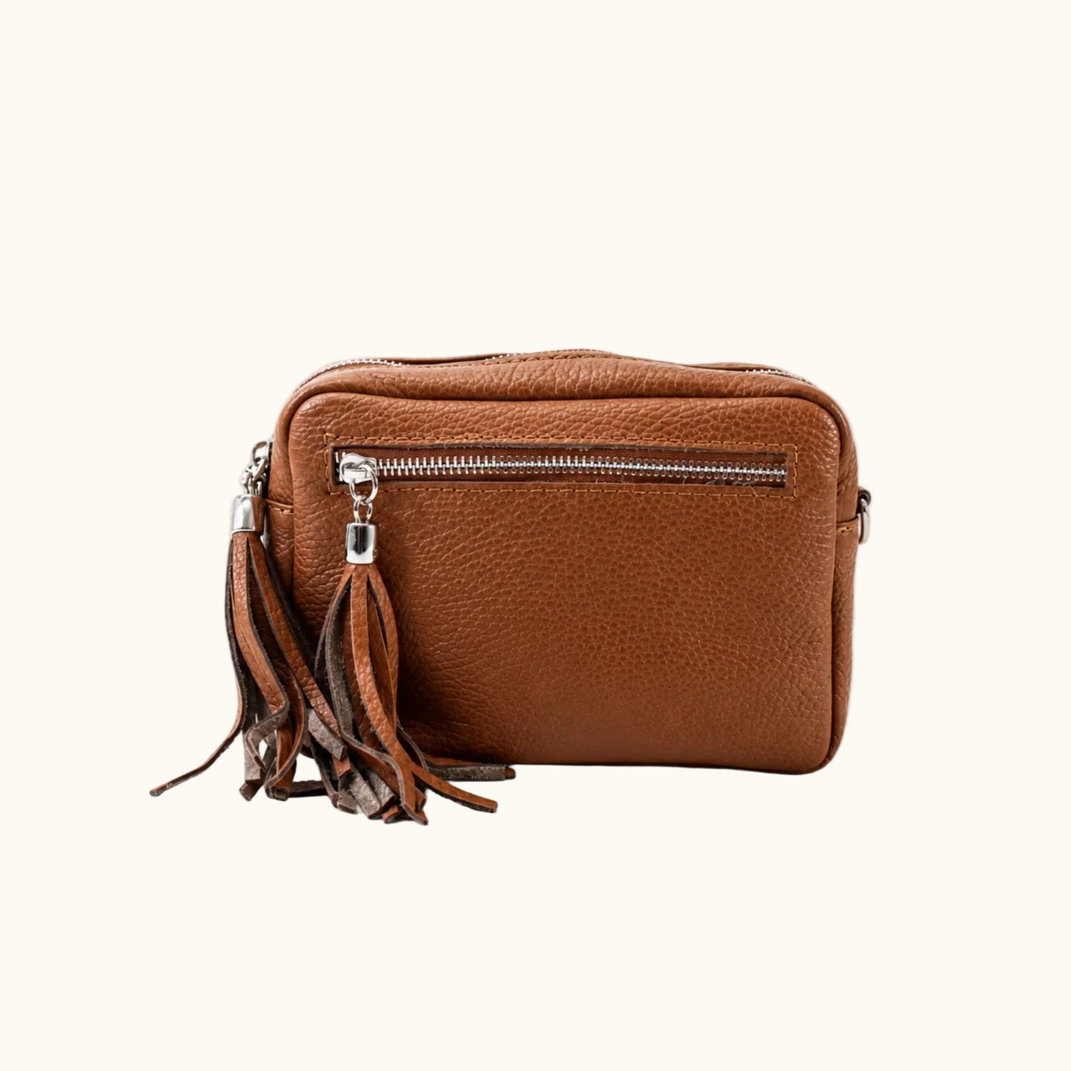Brown leather crossbody bag with a strap on a white background