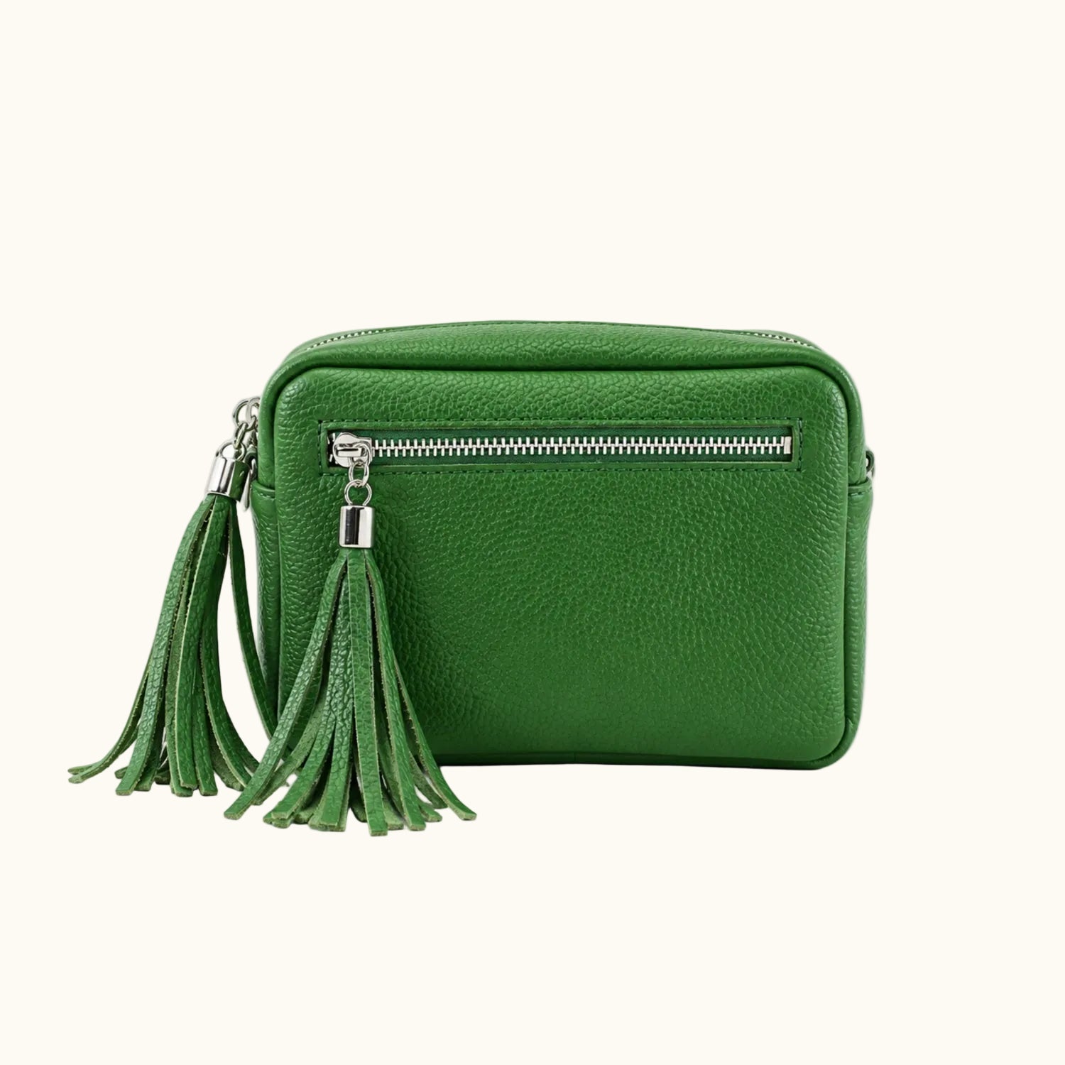 Green handbag with tassel on a white background