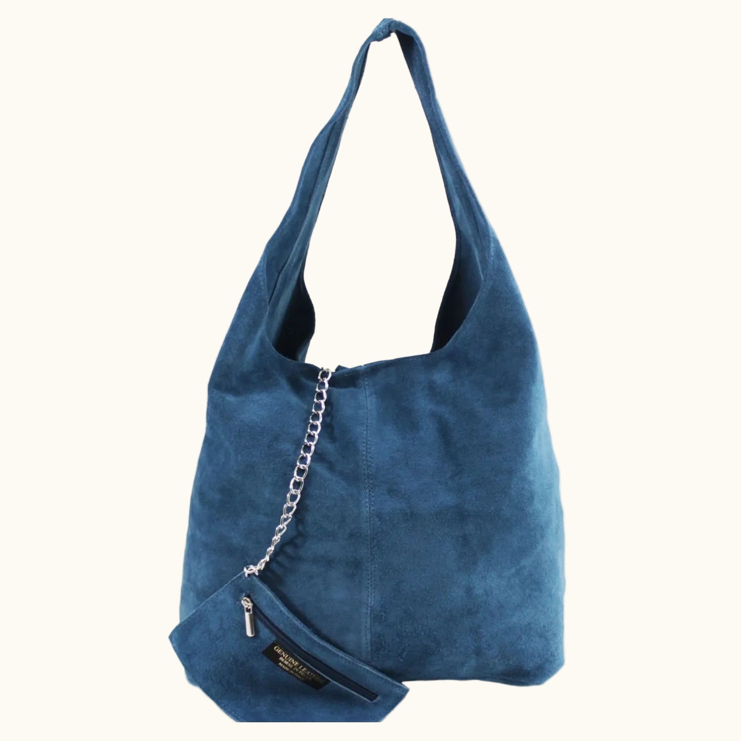 Blue suede handbag with a chain detail on a white background