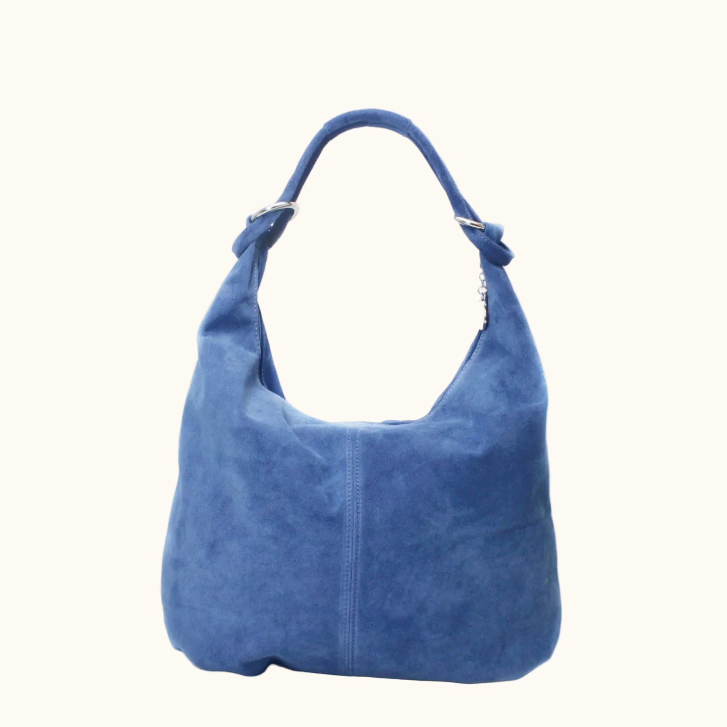 Blue suede handbag on a white background