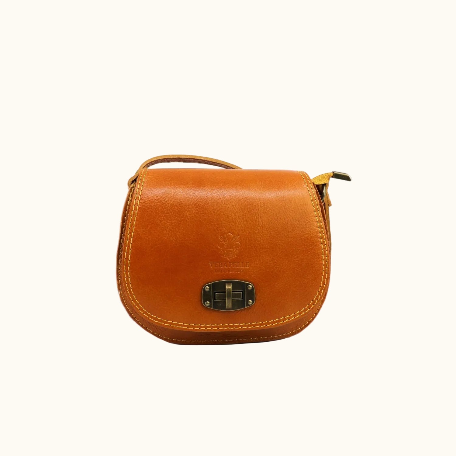 Brown leather handbag with a gold buckle on a white background