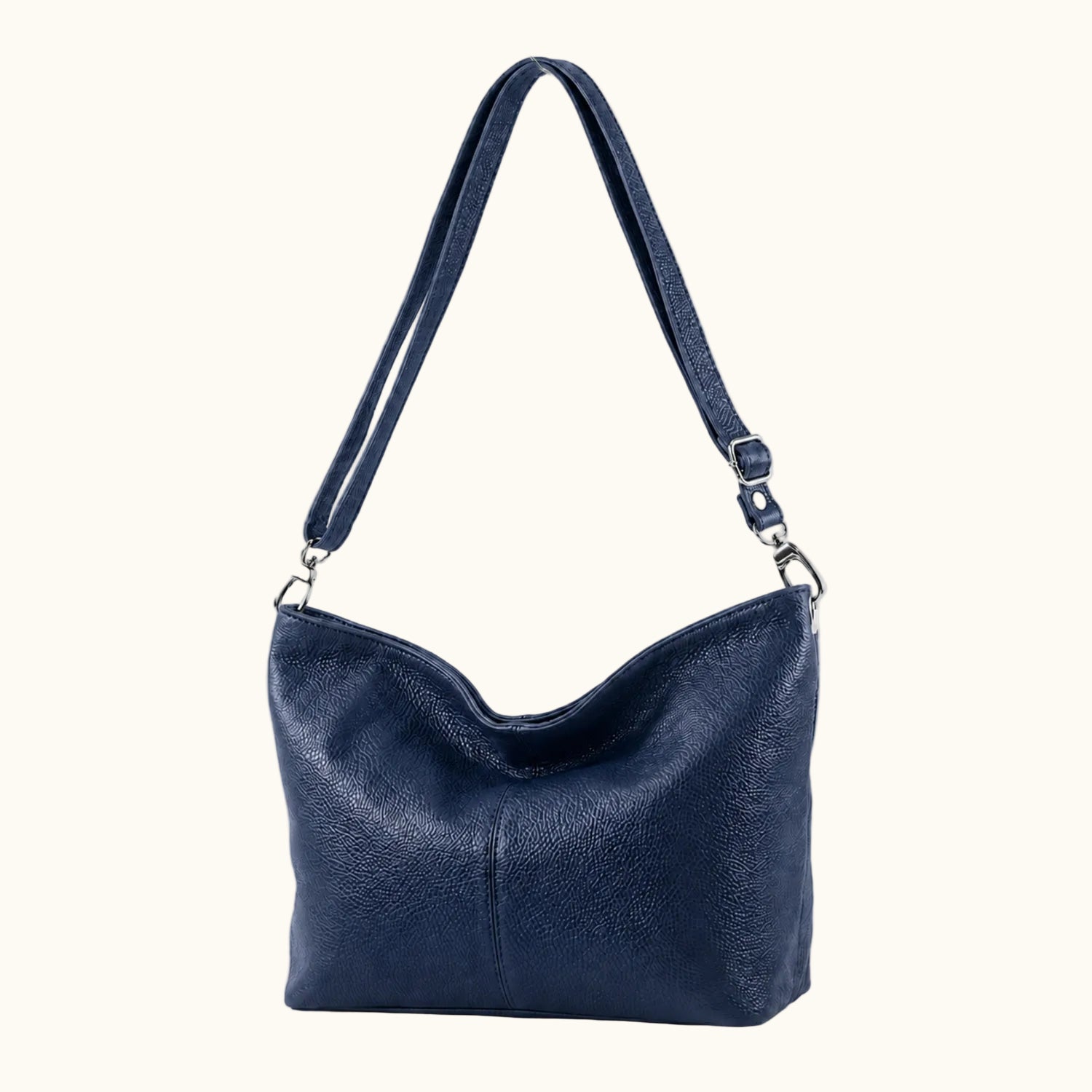 Black leather handbag with a shoulder strap on a white background