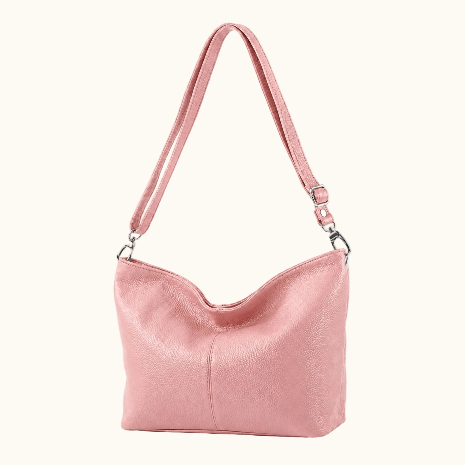 Pink handbag with a strap on a white background