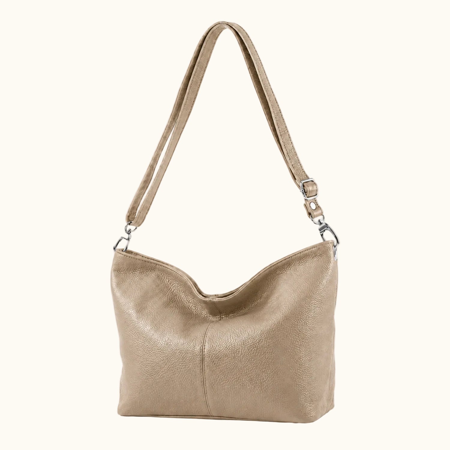 Beige handbag with a shoulder strap on a white background