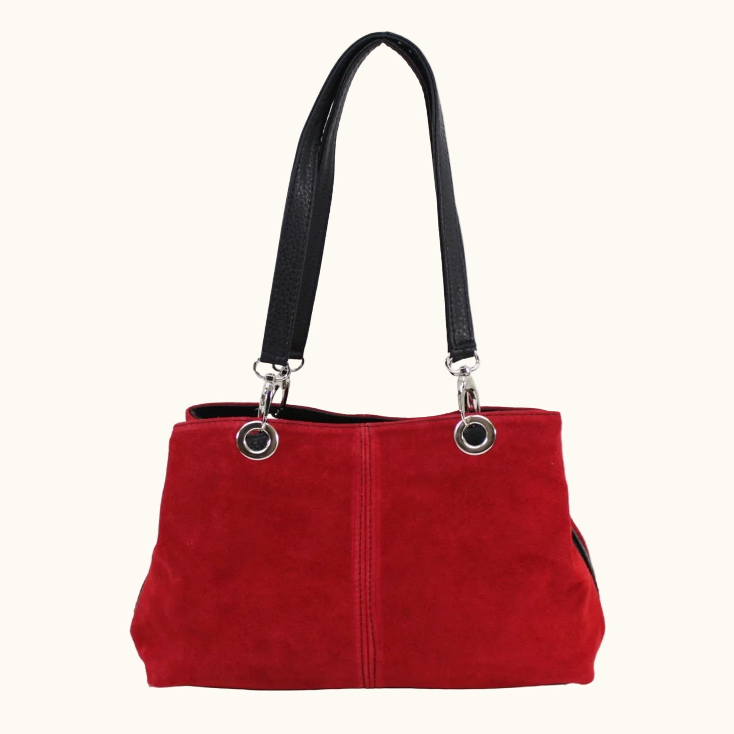 Red handbag with black handle on a white background