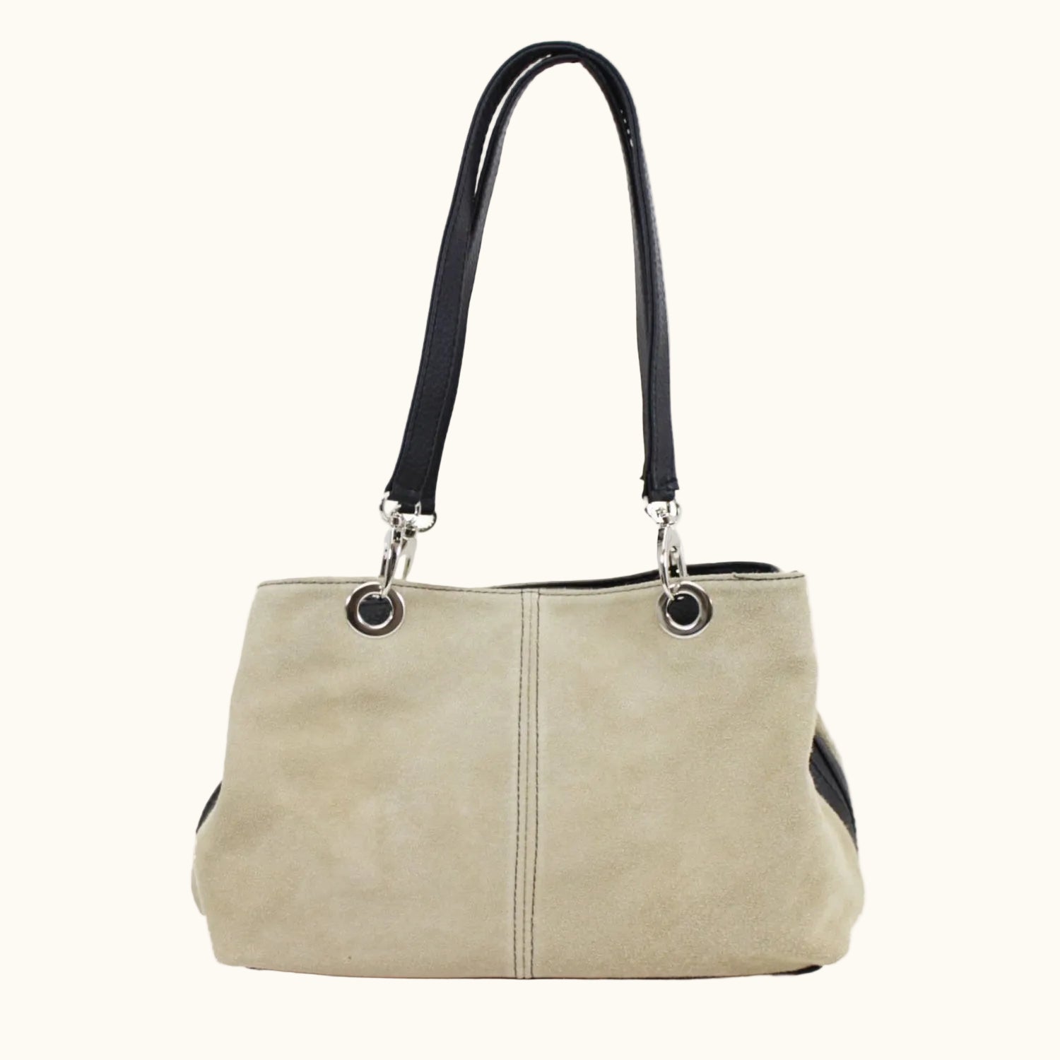 Beige handbag with black accents on a white background