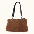 Brown handbag with black handles on a white background