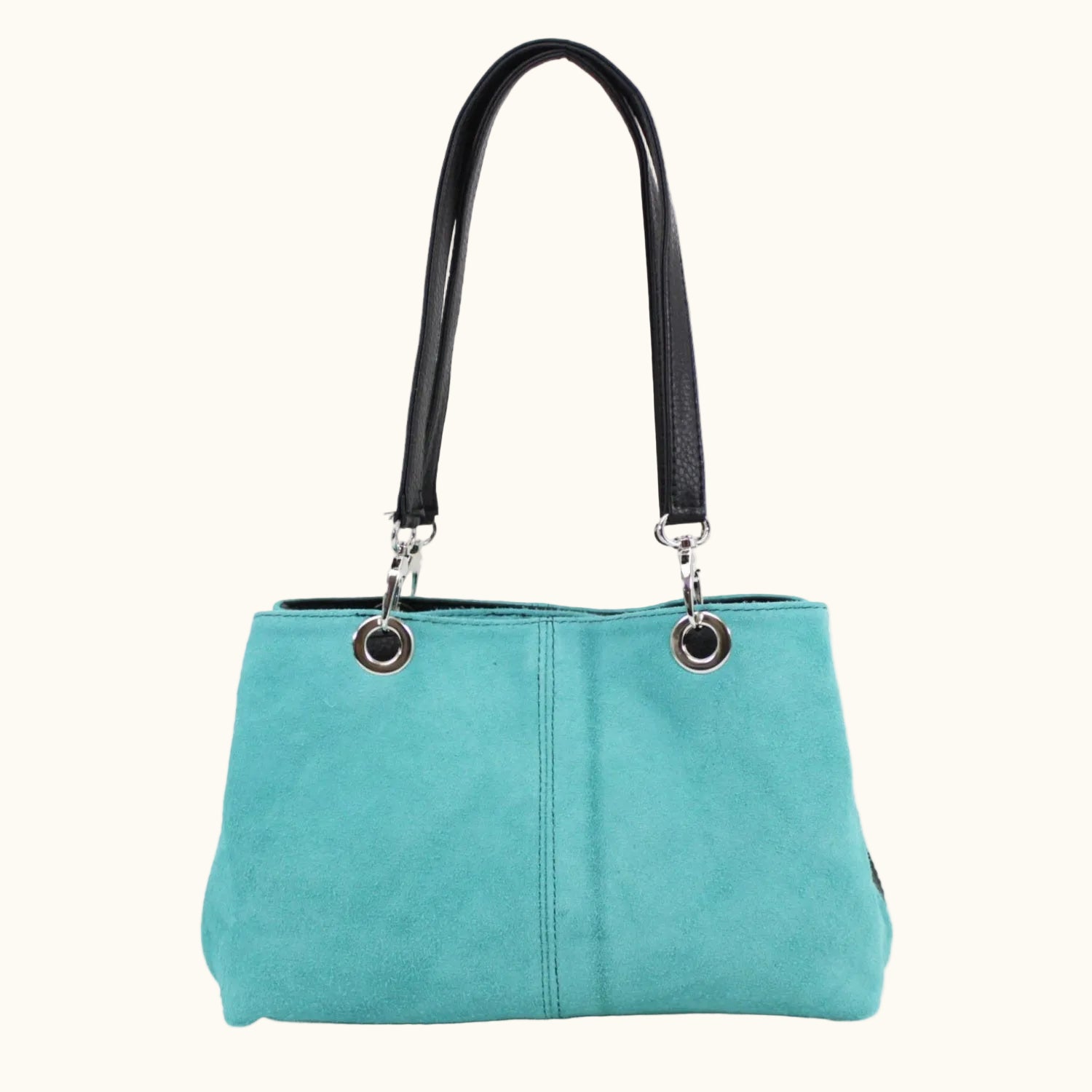 Turquoise handbag with black handle on a white background